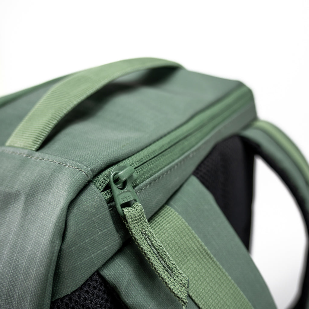 Close-up of the green FORWRD Court Ranger pickleball bag's YKK zipper pull on ripstop fabric, showcasing durable hardware and premium construction.