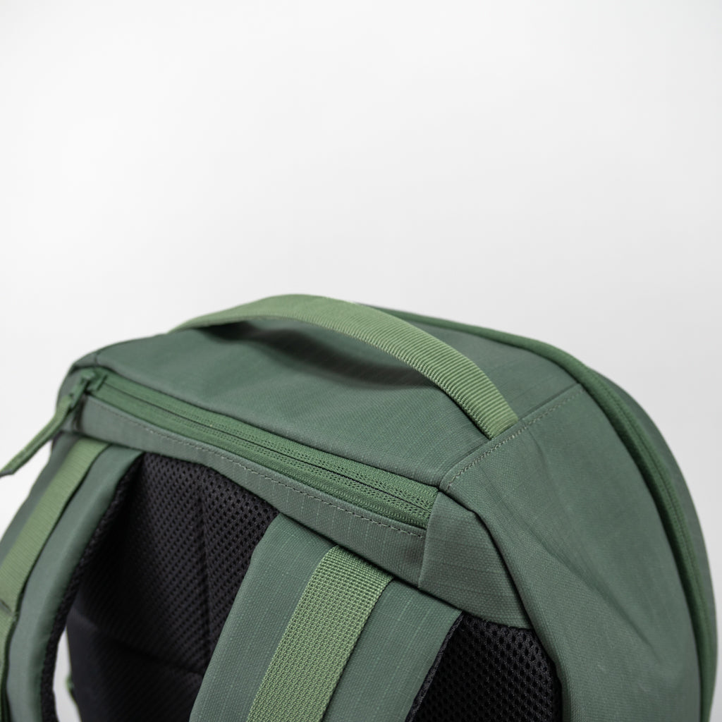 Close-up of the green FORWRD Court Ranger pickleball backpack’s reinforced top grab handle and durable ripstop fabric zipper panel.