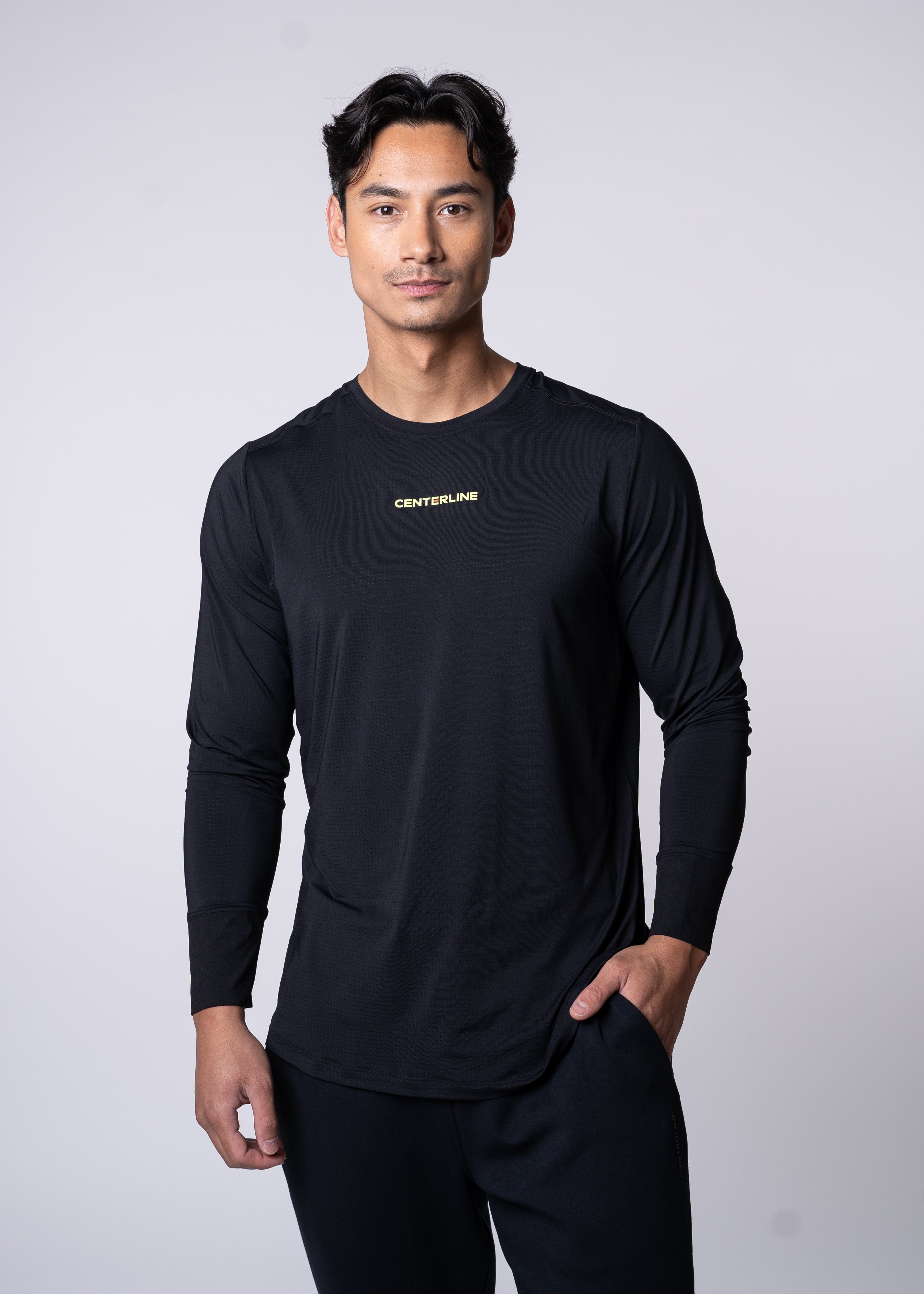 AirLite Men's Long Sleeve - FORWRD - Introducing the AirLite Men's Long Sleeve top, engineered with innovative GripTek™ textured knit on the sleeve cuffs. This top doubles as a convenient towel for quick perspiration management during matches. Experience next-level performance and functionality with this essential piece, ensuring you stay focused and comfortable on the court. Elevate your game with every serve, volley, and smash in this game-changing top.