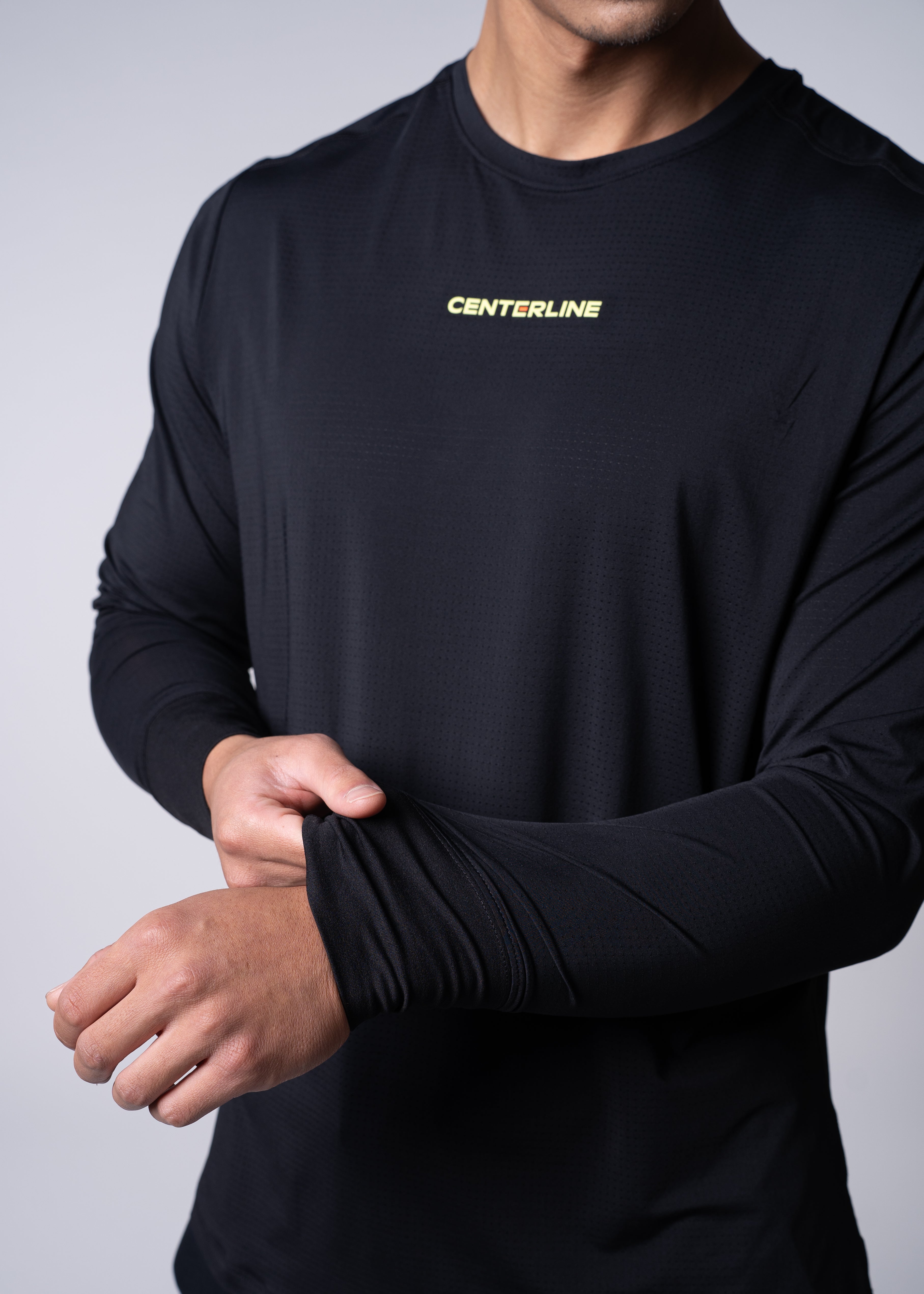 AirLite Men's Long Sleeve - FORWRD - Introducing the AirLite Men's Long Sleeve top, engineered with innovative GripTek™ textured knit on the sleeve cuffs. This top doubles as a convenient towel for quick perspiration management during matches. Experience next-level performance and functionality with this essential piece, ensuring you stay focused and comfortable on the court. Elevate your game with every serve, volley, and smash in this game-changing top.