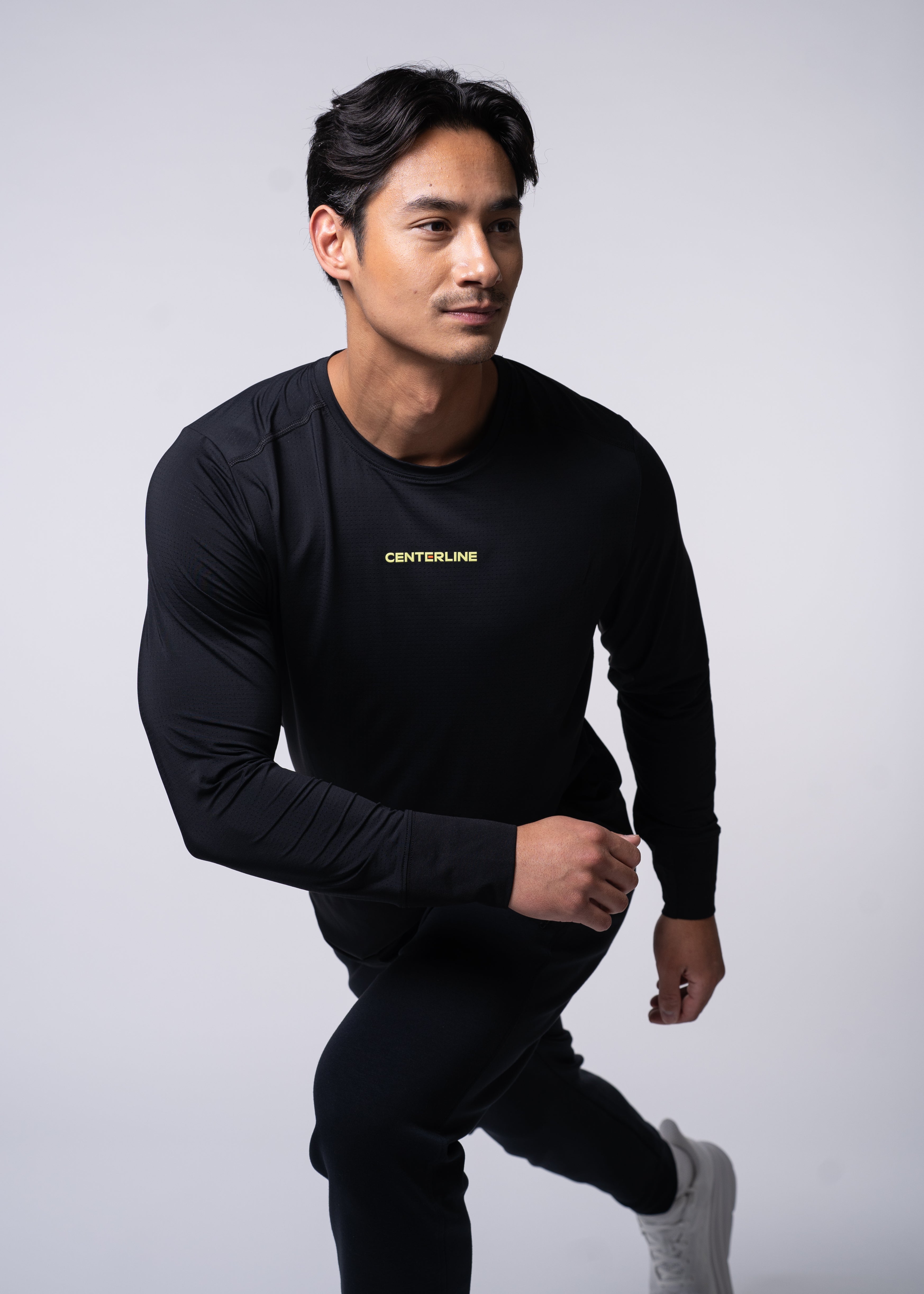 AirLite Men's Long Sleeve - FORWRD - Introducing the AirLite Men's Long Sleeve top, engineered with innovative GripTek™ textured knit on the sleeve cuffs. This top doubles as a convenient towel for quick perspiration management during matches. Experience next-level performance and functionality with this essential piece, ensuring you stay focused and comfortable on the court. Elevate your game with every serve, volley, and smash in this game-changing top.