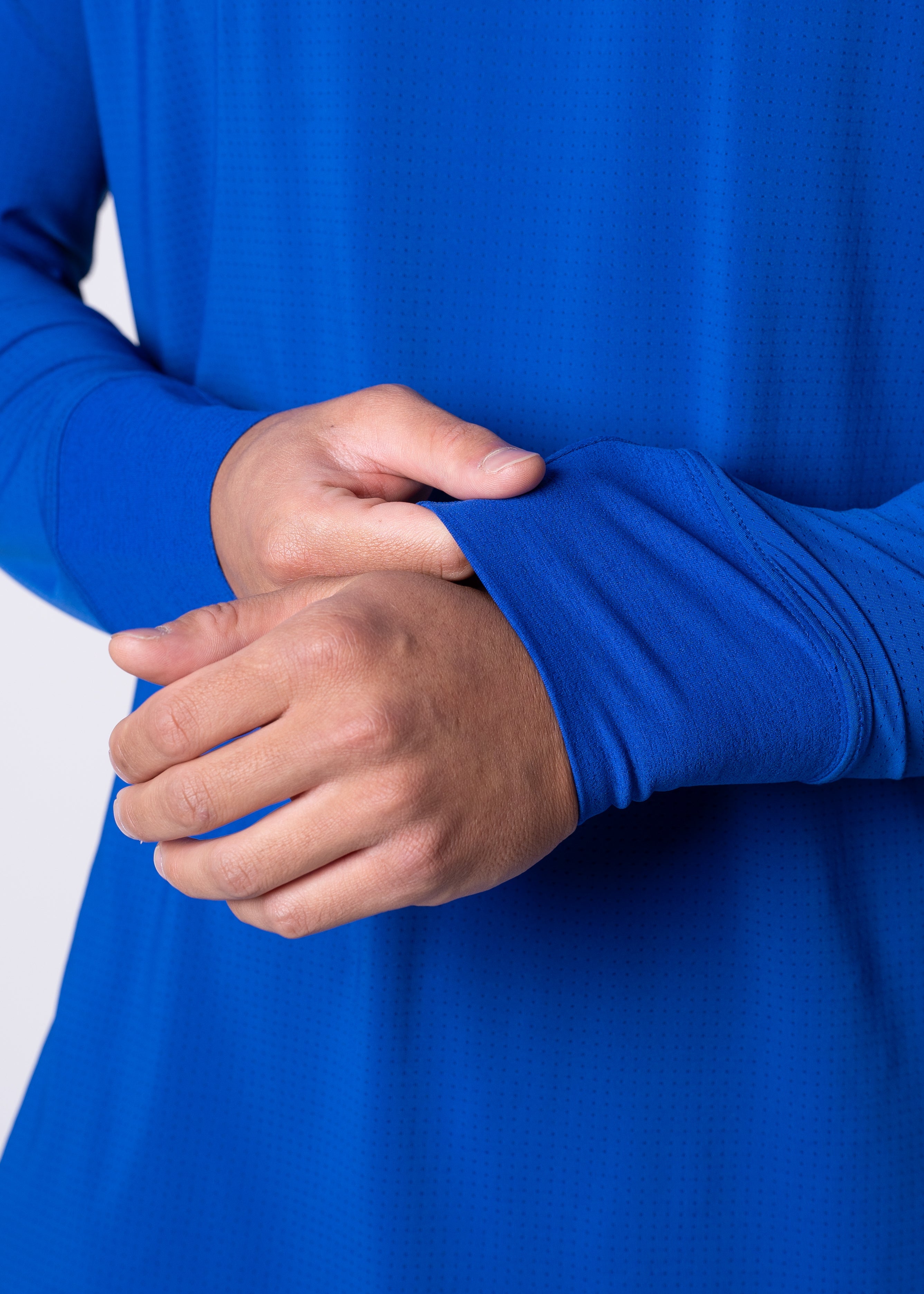 AirLite Men's Long Sleeve - FORWRD - Introducing the AirLite Men's Long Sleeve top, engineered with innovative GripTek™ textured knit on the sleeve cuffs. This top doubles as a convenient towel for quick perspiration management during matches. Experience next-level performance and functionality with this essential piece, ensuring you stay focused and comfortable on the court. Elevate your game with every serve, volley, and smash in this game-changing top.