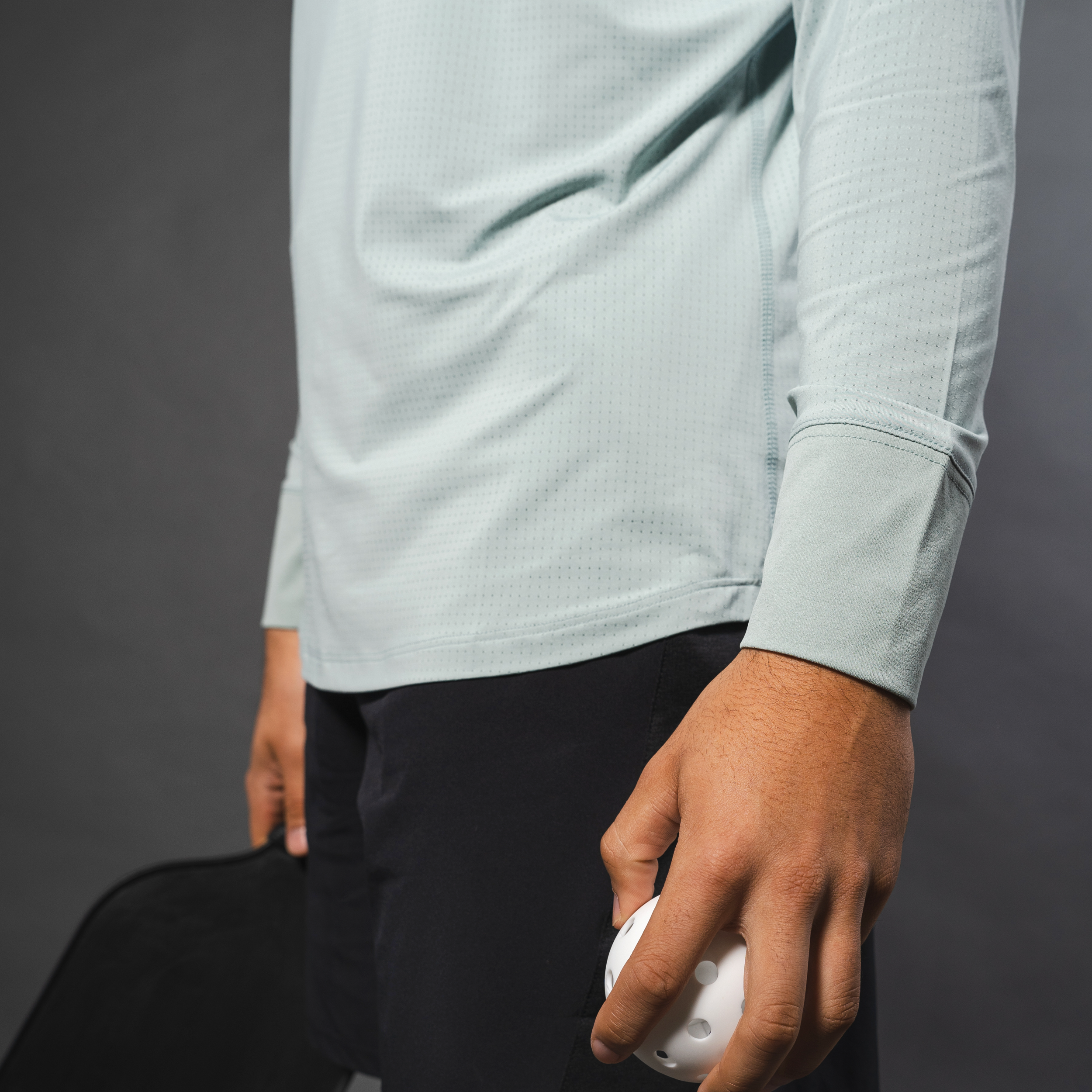 AirLite Men's Long Sleeve - FORWRD - Introducing the AirLite Men's Long Sleeve top, engineered with innovative GripTek™ textured knit on the sleeve cuffs. This top doubles as a convenient towel for quick perspiration management during matches. Experience next-level performance and functionality with this essential piece, ensuring you stay focused and comfortable on the court. Elevate your game with every serve, volley, and smash in this game-changing top.