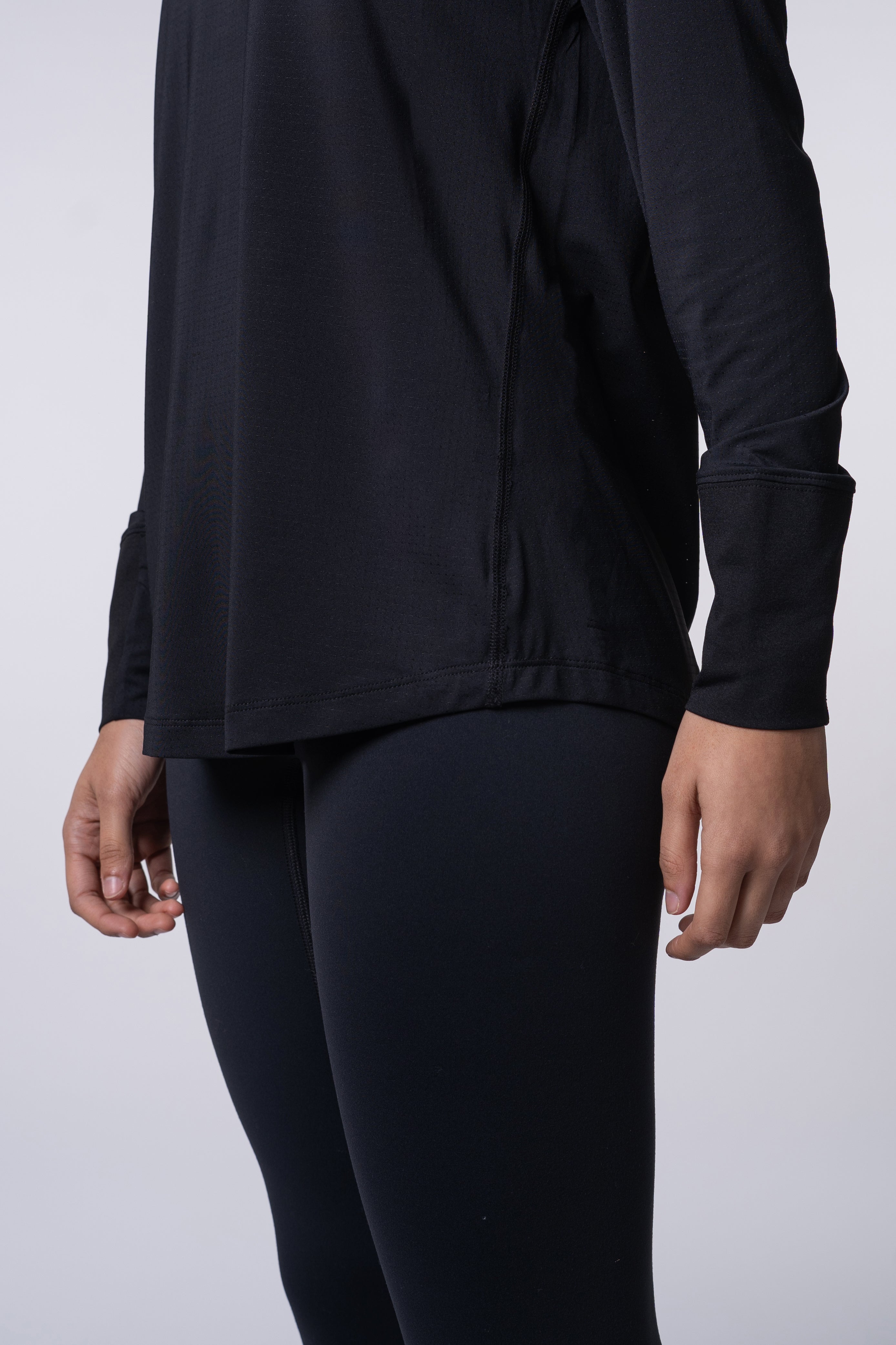 AirLite Women's Long Sleeve - FORWRD - Introducing the AirLite Women's Long Sleeve top, engineered with innovative GripTek™ textured knit on the sleeve cuffs. This top doubles as a convenient towel for quick perspiration management during matches. Experience next-level performance and functionality with this essential piece, ensuring you stay focused and comfortable on the court. Elevate your game with every serve, volley, and smash in this game-changing top.