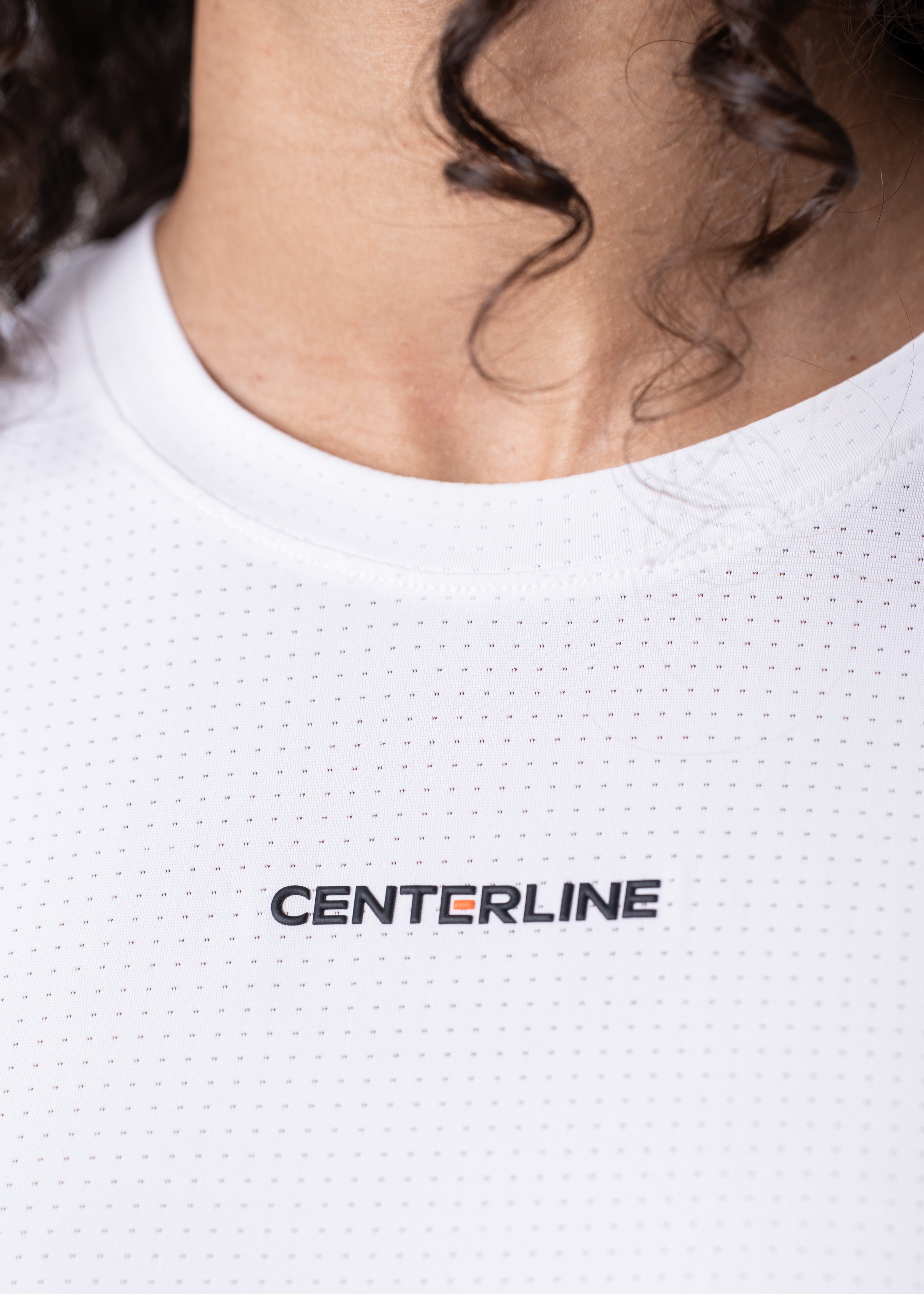 AirLite Women's Long Sleeve - FORWRD - Introducing the AirLite Women's Long Sleeve top, engineered with innovative GripTek™ textured knit on the sleeve cuffs. This top doubles as a convenient towel for quick perspiration management during matches. Experience next-level performance and functionality with this essential piece, ensuring you stay focused and comfortable on the court. Elevate your game with every serve, volley, and smash in this game-changing top.