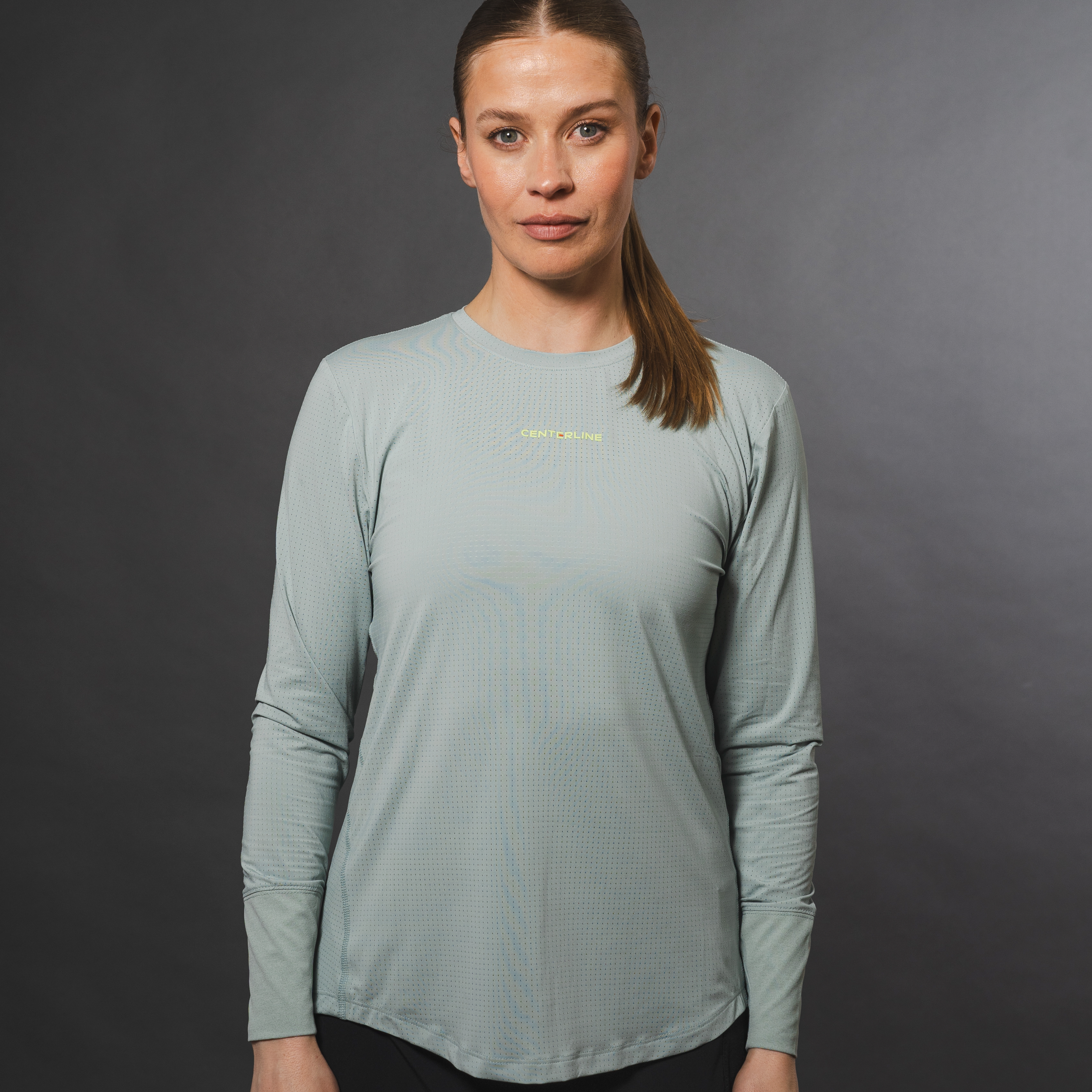 AirLite Women's Long Sleeve - FORWRD - Introducing the AirLite Women's Long Sleeve top, engineered with innovative GripTek™ textured knit on the sleeve cuffs. This top doubles as a convenient towel for quick perspiration management during matches. Experience next-level performance and functionality with this essential piece, ensuring you stay focused and comfortable on the court. Elevate your game with every serve, volley, and smash in this game-changing top.
