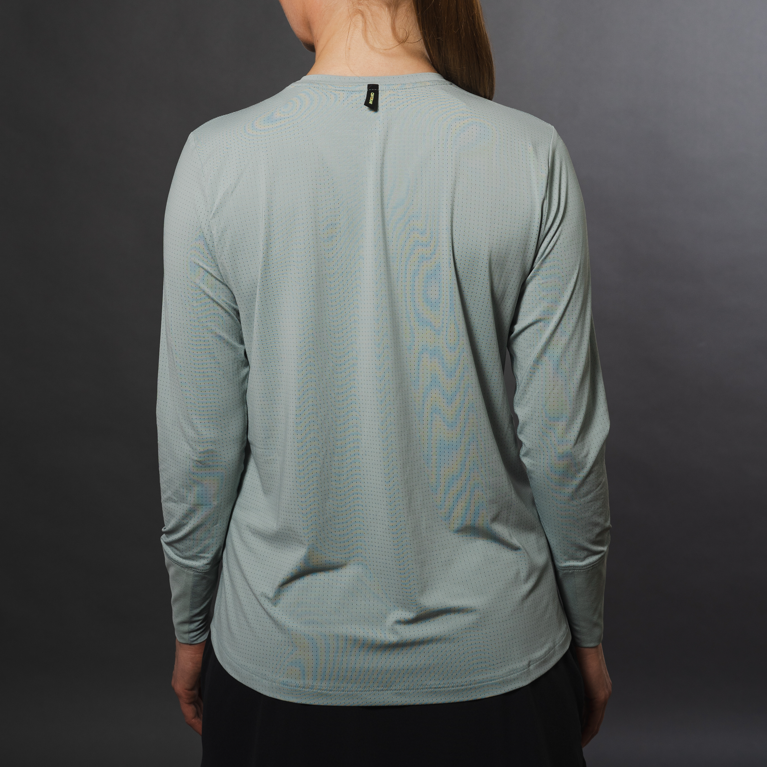 AirLite Women's Long Sleeve - FORWRD - Introducing the AirLite Women's Long Sleeve top, engineered with innovative GripTek™ textured knit on the sleeve cuffs. This top doubles as a convenient towel for quick perspiration management during matches. Experience next-level performance and functionality with this essential piece, ensuring you stay focused and comfortable on the court. Elevate your game with every serve, volley, and smash in this game-changing top.