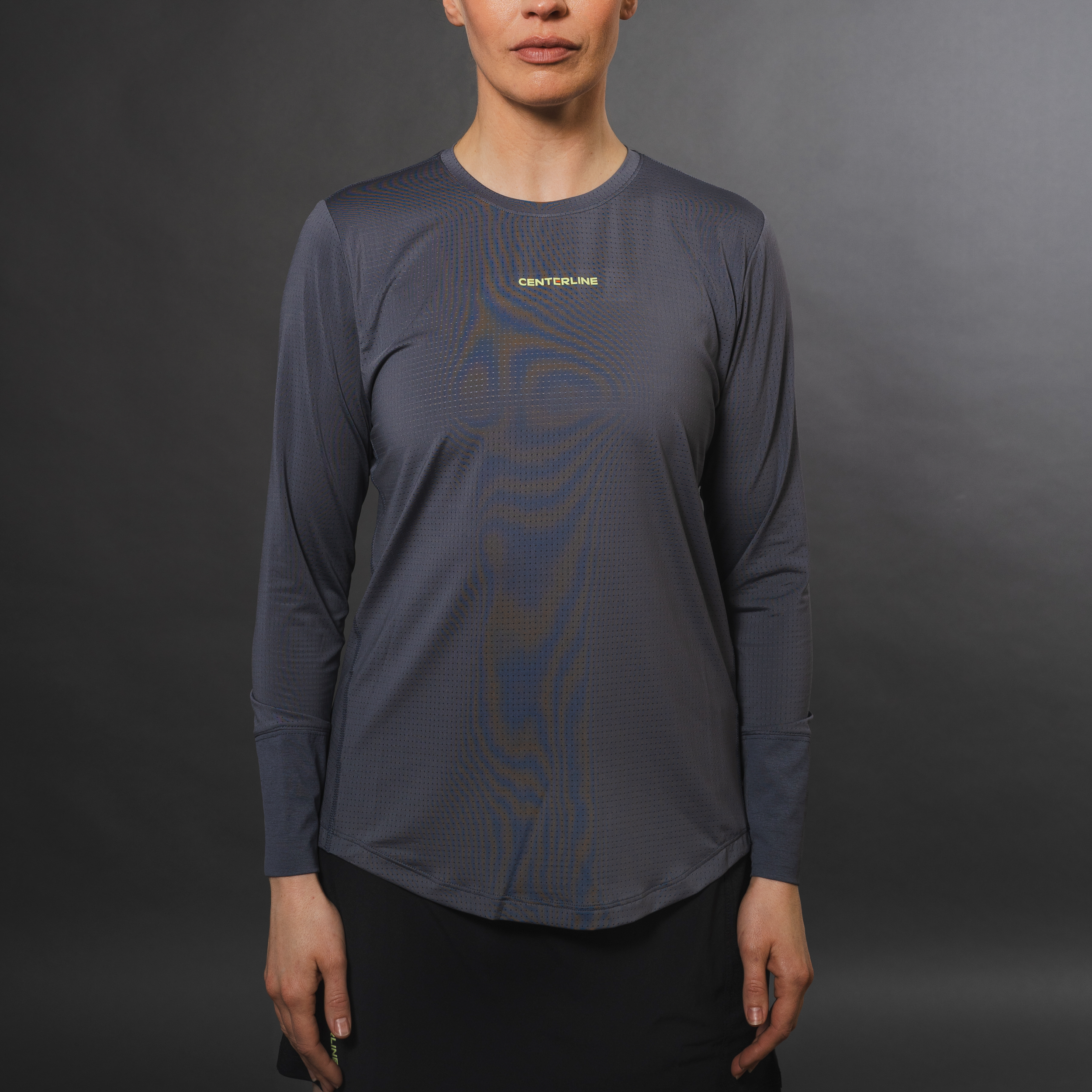AirLite Women's Long Sleeve - FORWRD - Introducing the AirLite Women's Long Sleeve top, engineered with innovative GripTek™ textured knit on the sleeve cuffs. This top doubles as a convenient towel for quick perspiration management during matches. Experience next-level performance and functionality with this essential piece, ensuring you stay focused and comfortable on the court. Elevate your game with every serve, volley, and smash in this game-changing top.