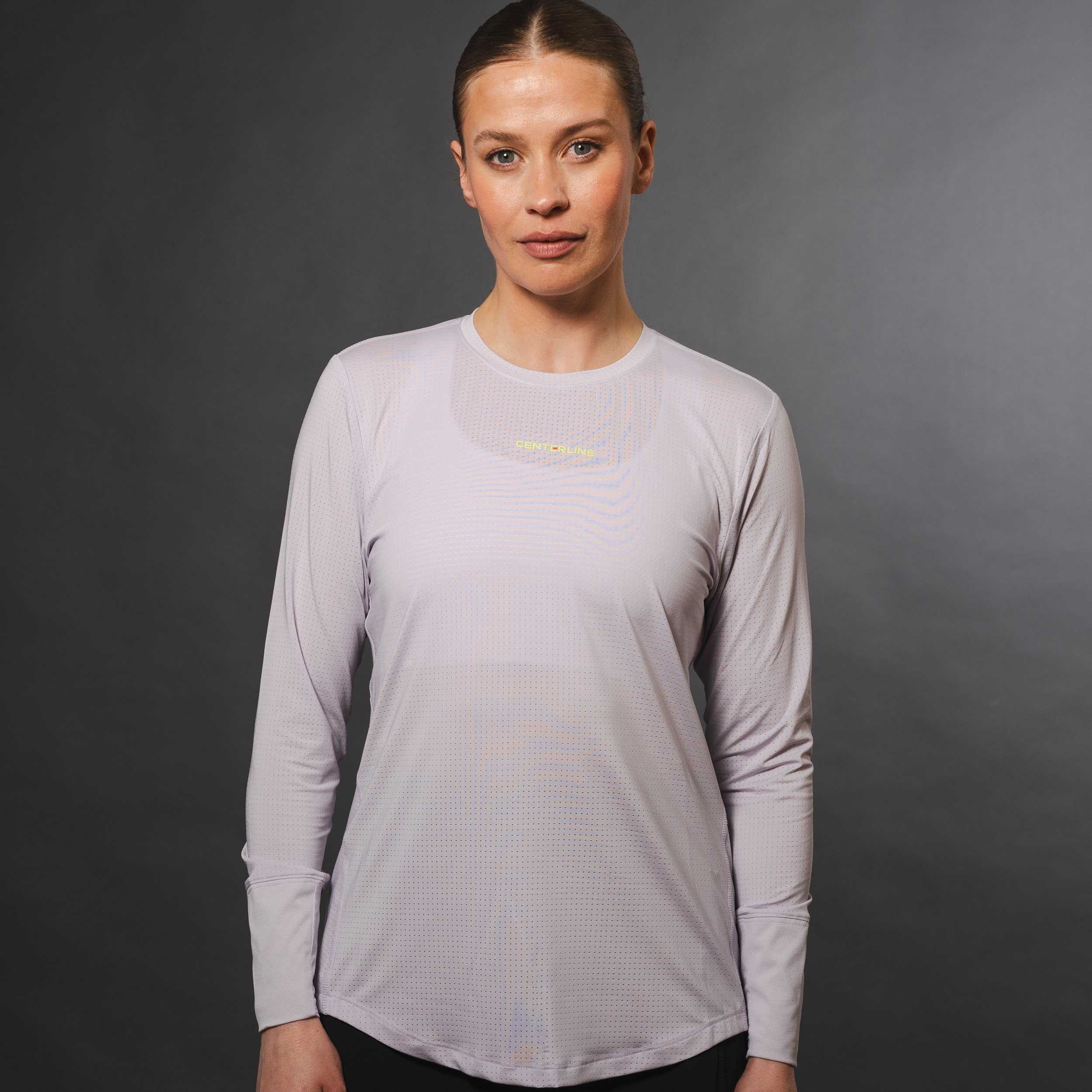 AirLite Women's Long Sleeve - FORWRD - Introducing the AirLite Women's Long Sleeve top, engineered with innovative GripTek™ textured knit on the sleeve cuffs. This top doubles as a convenient towel for quick perspiration management during matches. Experience next-level performance and functionality with this essential piece, ensuring you stay focused and comfortable on the court. Elevate your game with every serve, volley, and smash in this game-changing top.