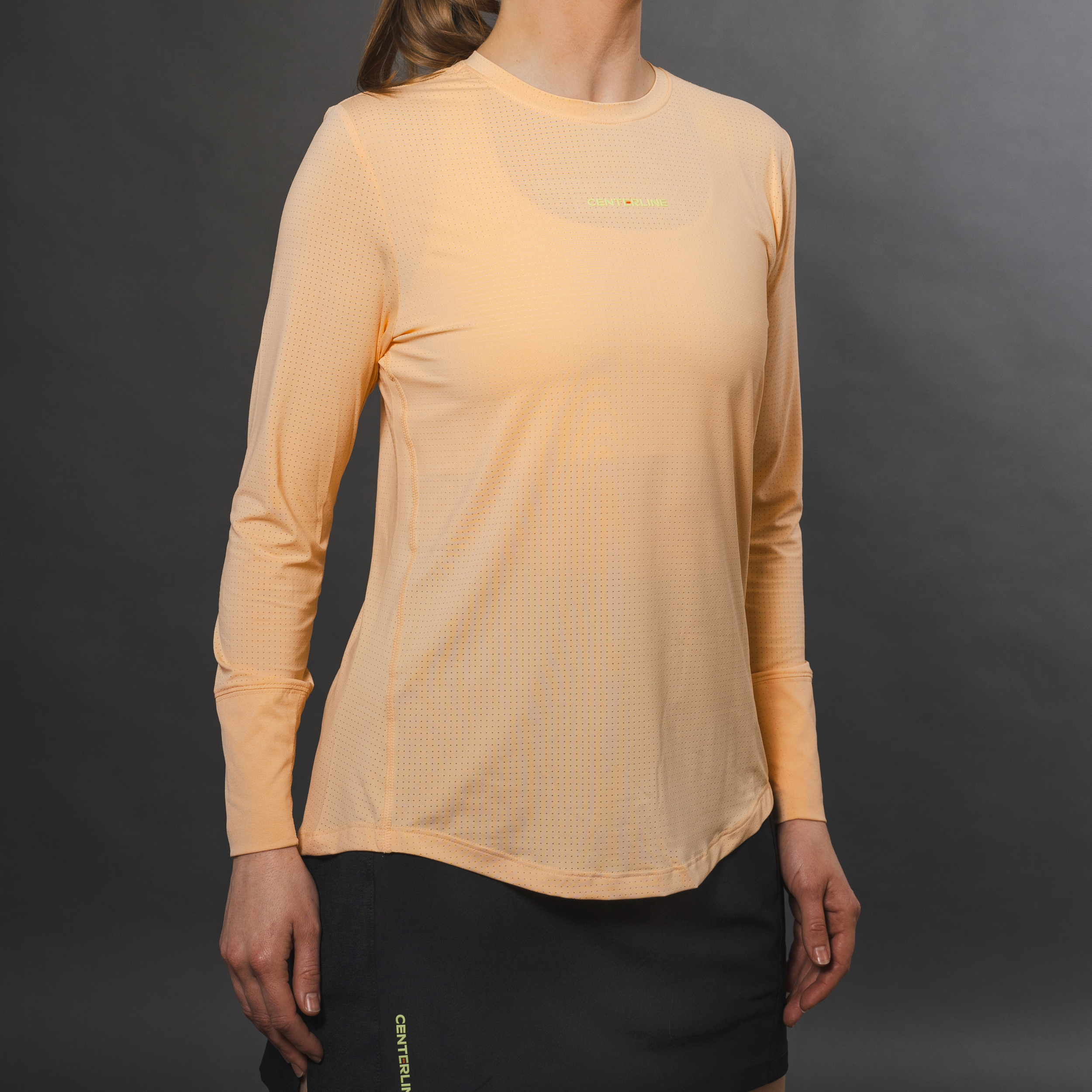 AirLite Women's Long Sleeve - FORWRD - Introducing the AirLite Women's Long Sleeve top, engineered with innovative GripTek™ textured knit on the sleeve cuffs. This top doubles as a convenient towel for quick perspiration management during matches. Experience next-level performance and functionality with this essential piece, ensuring you stay focused and comfortable on the court. Elevate your game with every serve, volley, and smash in this game-changing top.