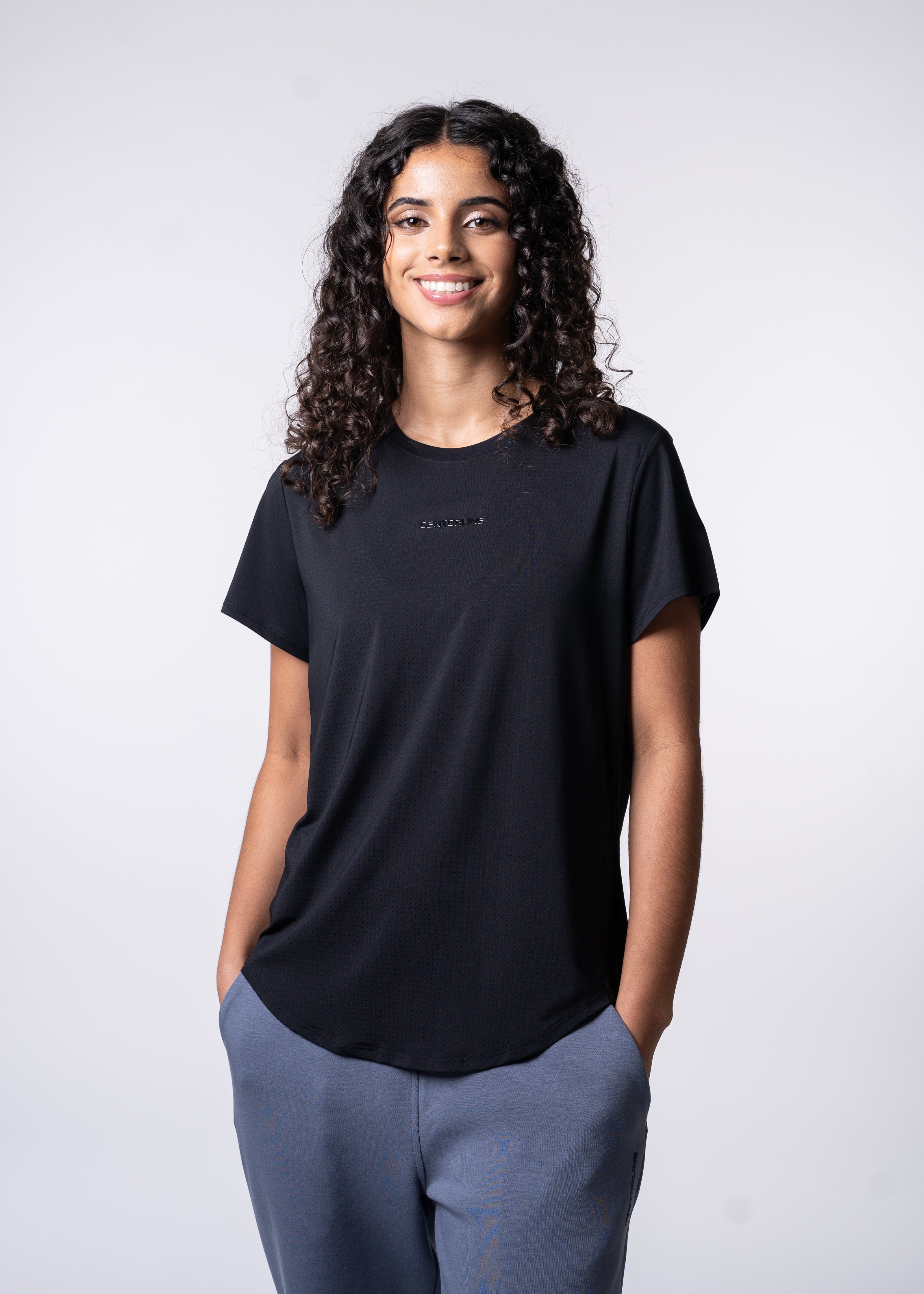 AirLite Women's Tee - FORWRD - Elevate your game with the AirLite Women's Tee, engineered from ultra-breathable mesh fabric for unmatched ventilation during pickleball play. Curved hem ensures confidence in every move, allowing you to showcase your agility without compromising on comfort. Experience the perfect blend of style and performance with this essential addition to your wardrobe.