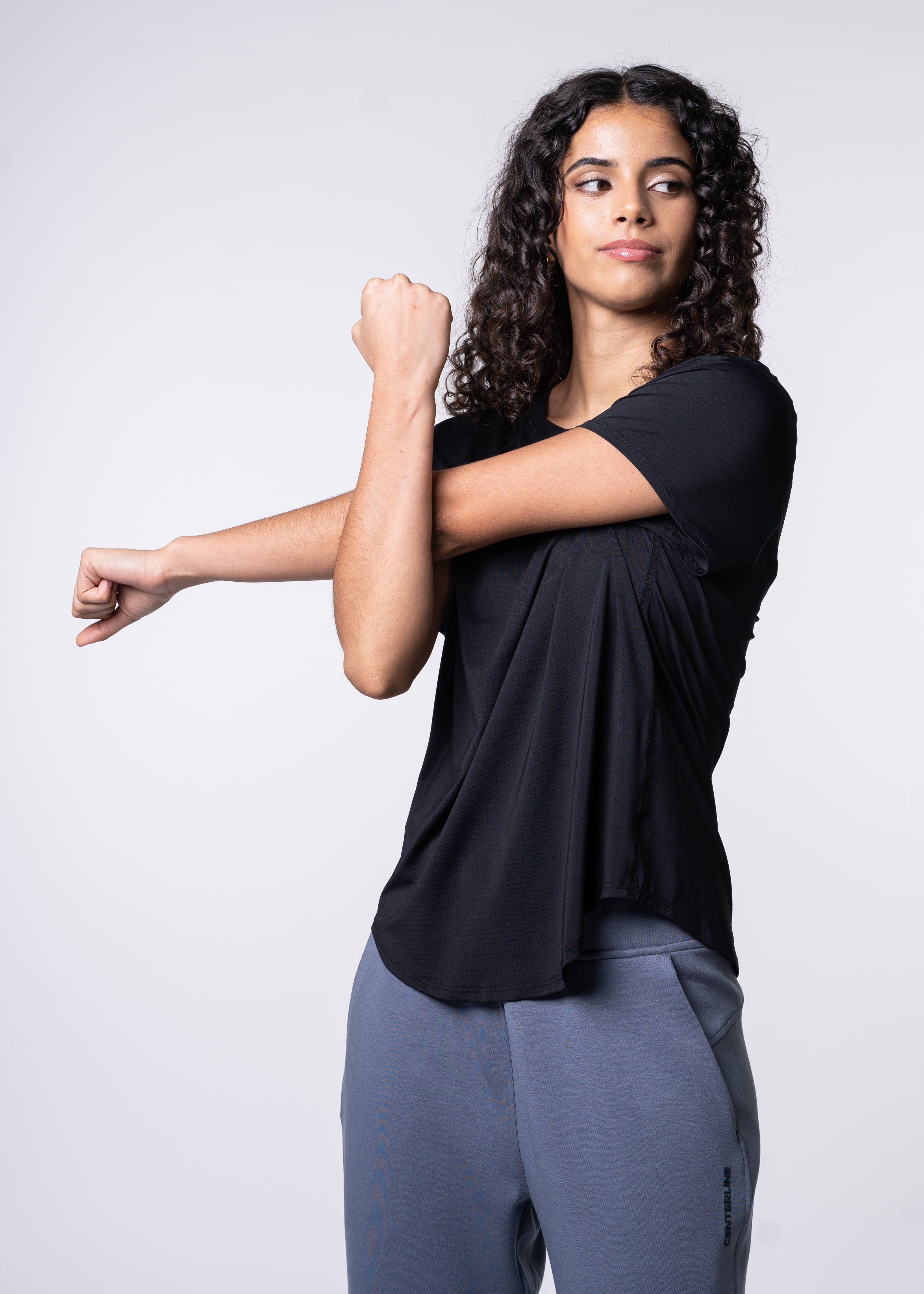 AirLite Women's Tee - FORWRD - Elevate your game with the AirLite Women's Tee, engineered from ultra-breathable mesh fabric for unmatched ventilation during pickleball play. Curved hem ensures confidence in every move, allowing you to showcase your agility without compromising on comfort. Experience the perfect blend of style and performance with this essential addition to your wardrobe.