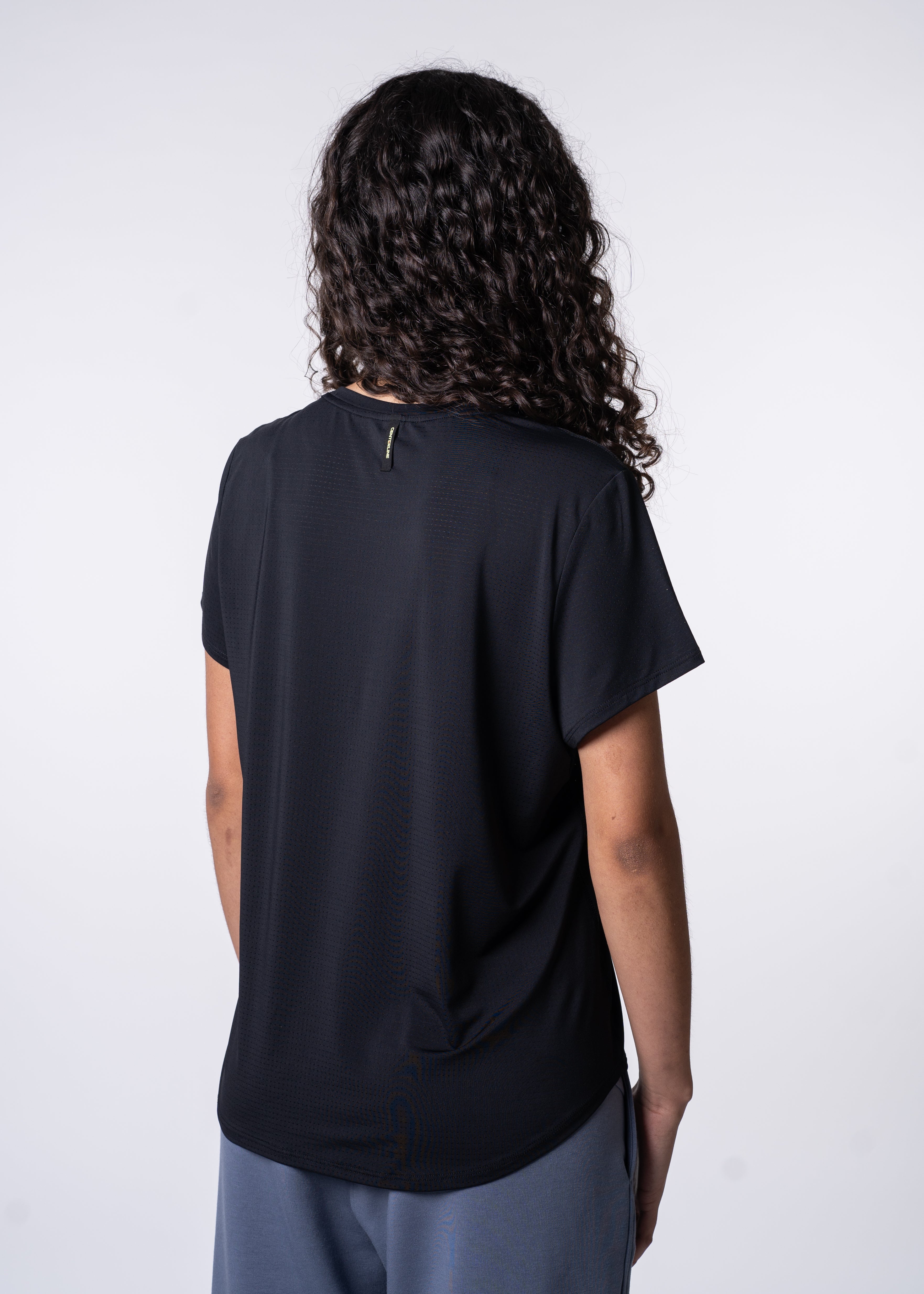 AirLite Women's Tee - FORWRD - Elevate your game with the AirLite Women's Tee, engineered from ultra-breathable mesh fabric for unmatched ventilation during pickleball play. Curved hem ensures confidence in every move, allowing you to showcase your agility without compromising on comfort. Experience the perfect blend of style and performance with this essential addition to your wardrobe.