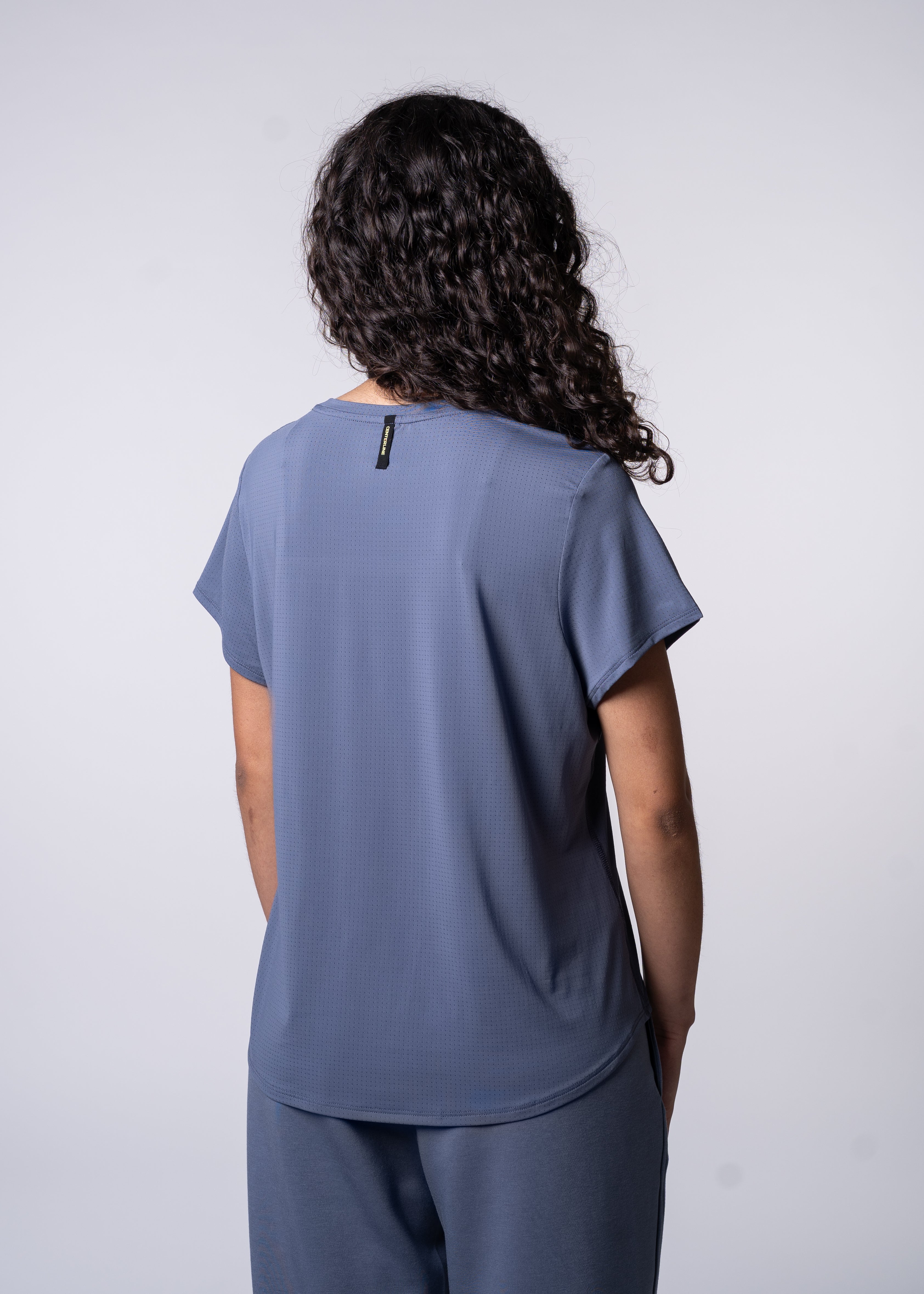 AirLite Women's Tee - FORWRD - Elevate your game with the AirLite Women's Tee, engineered from ultra-breathable mesh fabric for unmatched ventilation during pickleball play. Curved hem ensures confidence in every move, allowing you to showcase your agility without compromising on comfort. Experience the perfect blend of style and performance with this essential addition to your wardrobe.