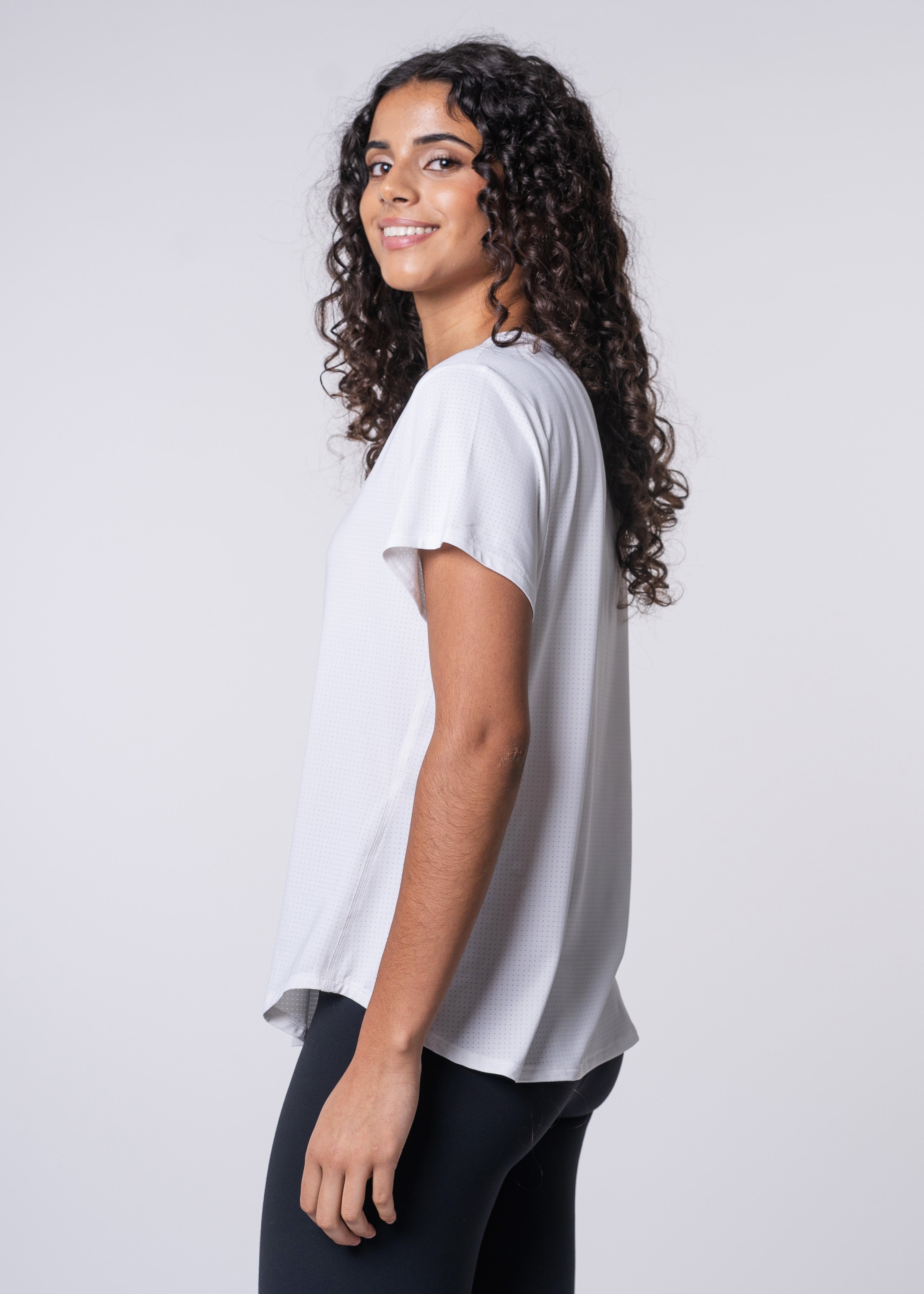 AirLite Women's Tee - FORWRD - Elevate your game with the AirLite Women's Tee, engineered from ultra-breathable mesh fabric for unmatched ventilation during pickleball play. Curved hem ensures confidence in every move, allowing you to showcase your agility without compromising on comfort. Experience the perfect blend of style and performance with this essential addition to your wardrobe.