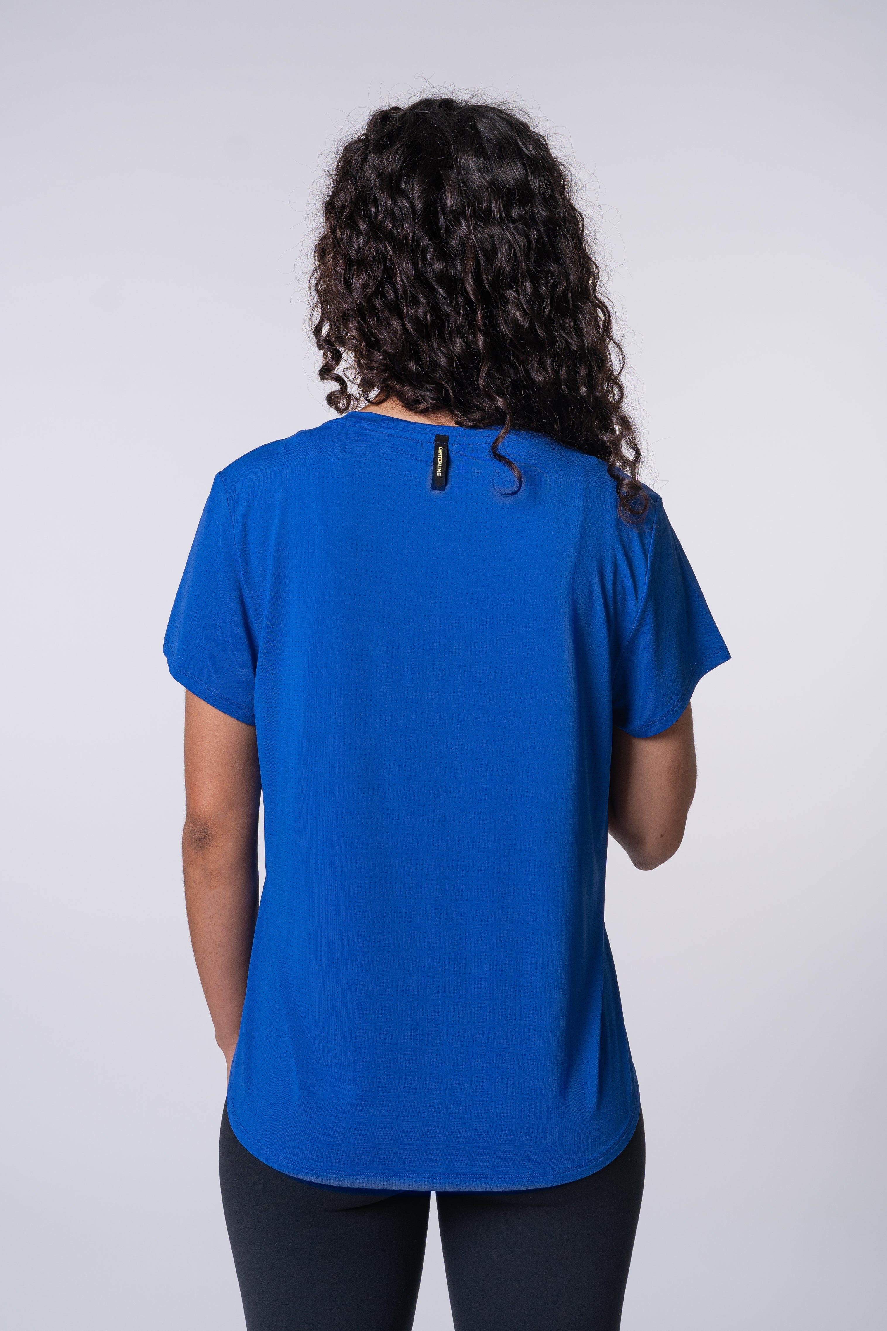 AirLite Women's Tee - FORWRD - Elevate your game with the AirLite Women's Tee, engineered from ultra-breathable mesh fabric for unmatched ventilation during pickleball play. Curved hem ensures confidence in every move, allowing you to showcase your agility without compromising on comfort. Experience the perfect blend of style and performance with this essential addition to your wardrobe.