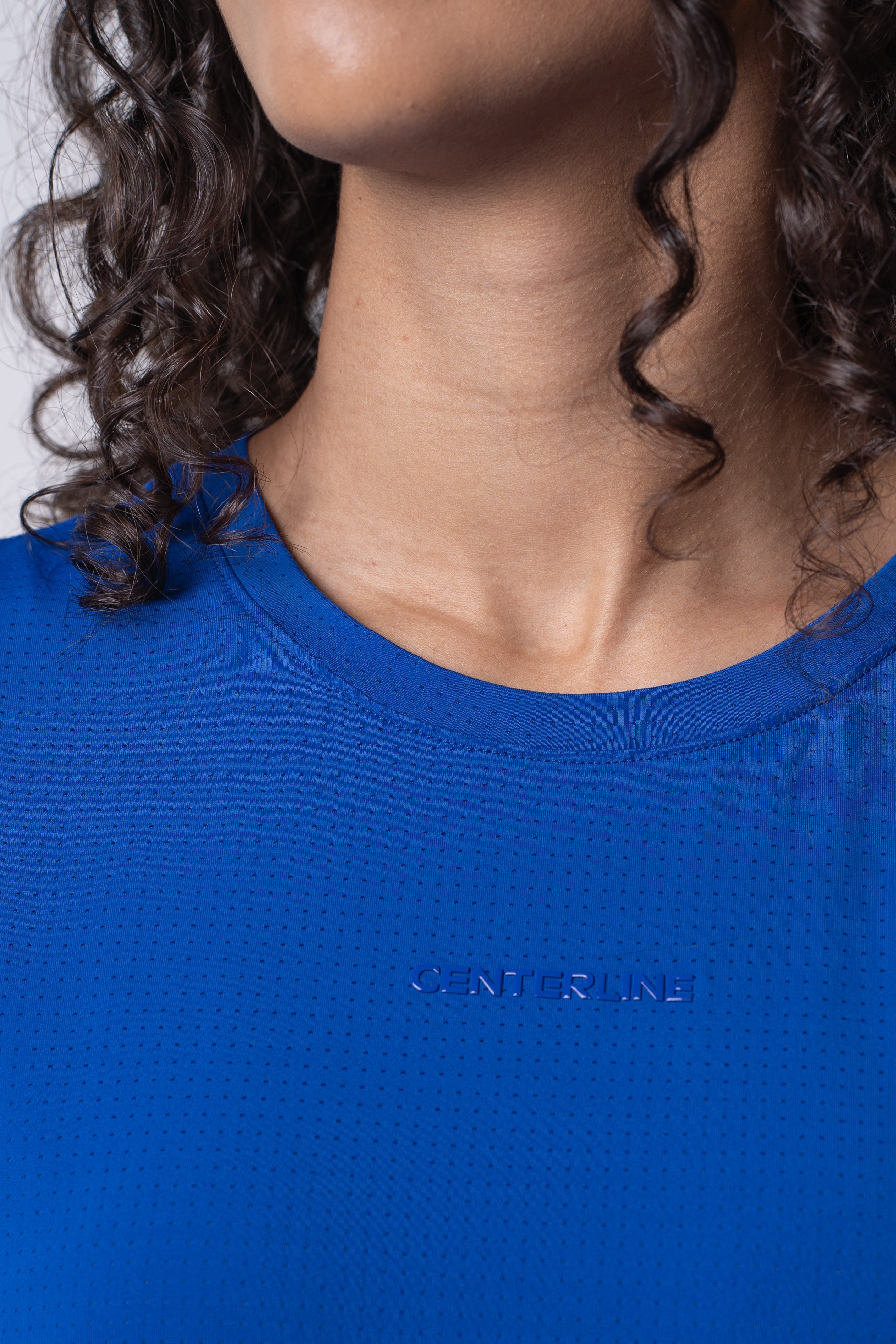 AirLite Women's Tee - FORWRD - Elevate your game with the AirLite Women's Tee, engineered from ultra-breathable mesh fabric for unmatched ventilation during pickleball play. Curved hem ensures confidence in every move, allowing you to showcase your agility without compromising on comfort. Experience the perfect blend of style and performance with this essential addition to your wardrobe.
