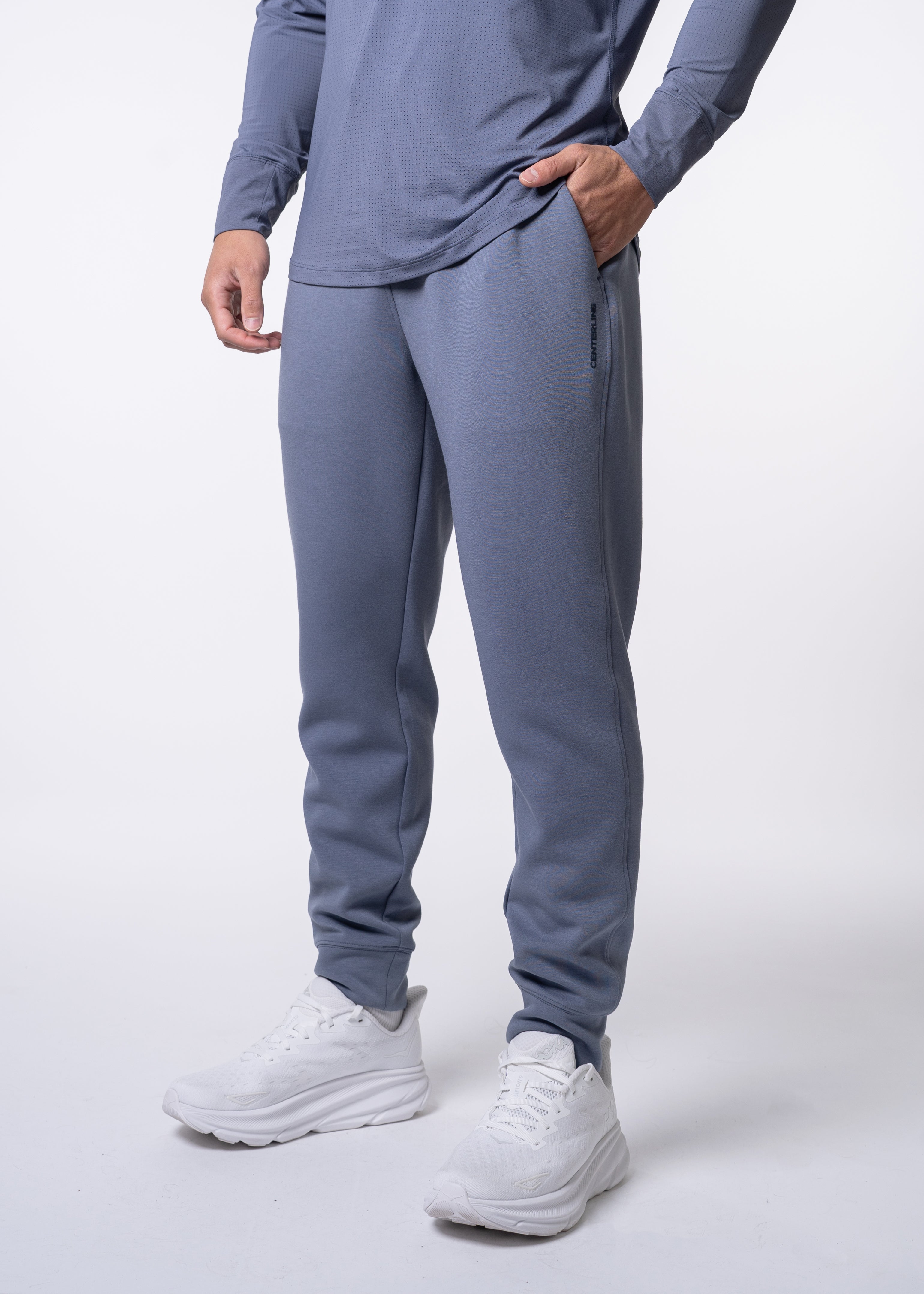 Apres Men's Jogger - FORWRD - His go-to Apres Play jogger, featuring an easy pull-on waistband with drawcord for adjustability and relaxed fit for post-game comfort. Soft and comfortable water repellent fabric helps protect you from the elements, while front hand pockets add convenient storage. With a streetwear-inspired look and functional design, these joggers transition seamlessly from court to street.