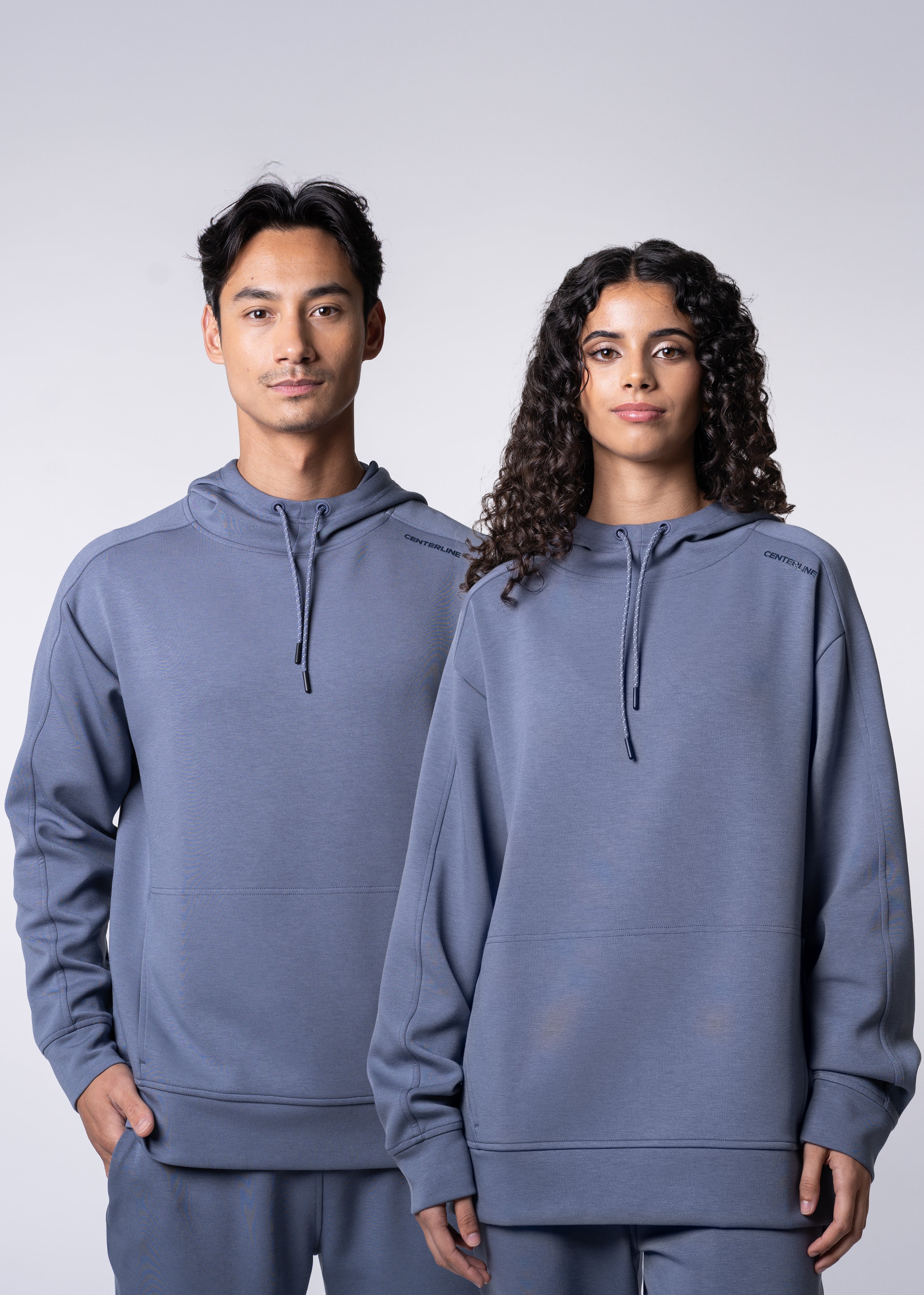Apres Unisex Hooded Sweatshirt - FORWRD - The ultimate post-game hooded pullover, designed with a relaxed varsity-inspired fit for comfort and style. Soft and comfortable, water repellent fabric, with a fully functional hood with adjustable draw cord helps keep you protected from the elements. Front hand pockets offer a secure phone storage option, adding practicality to this street-style piece that easily transitions from court to casual activities. This unisex hoodie has an athletic fit