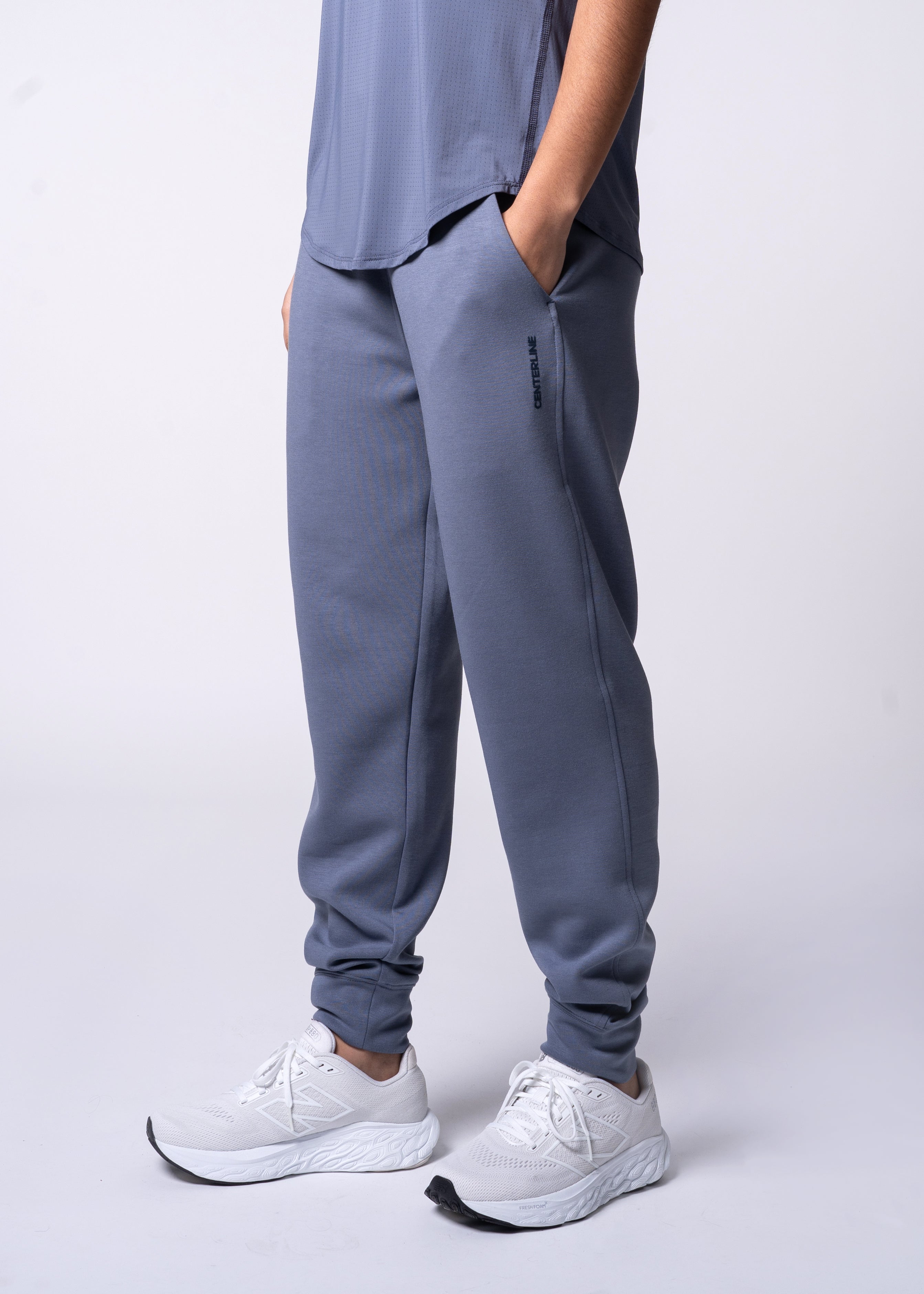 Apres Women's Jogger - FORWRD - Her go-to Apres Play jogger, featuring an easy pull-on waistband and relaxed fit for post-game comfort. Soft and comfortable water repellent fabric helps protect you from the elements, while front hand pockets add convenient storage. With a streetwear-inspired look and functional design, these joggers transition seamlessly from court to street.