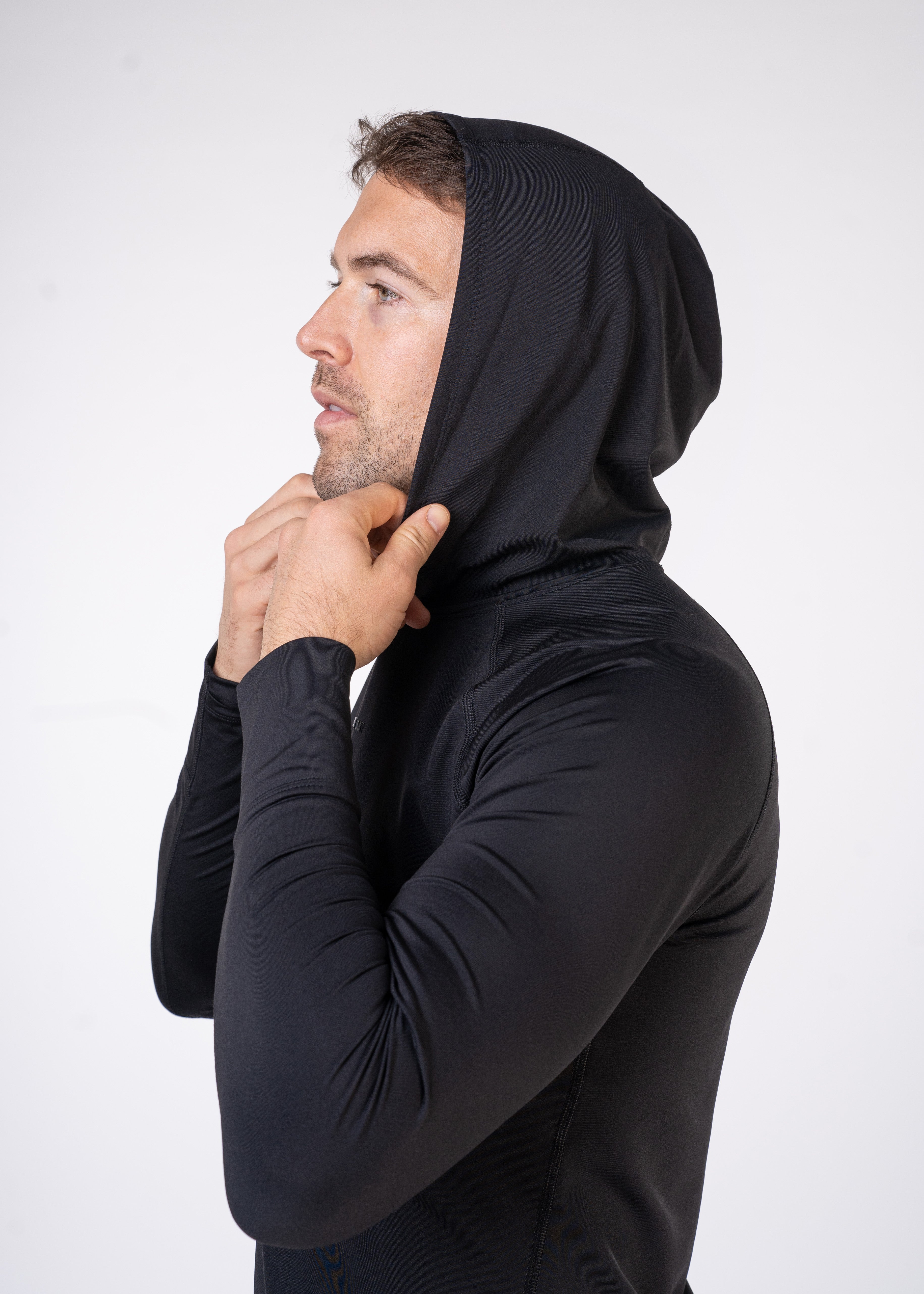 Layering Hoodie Men's - FORWRD - Stay cool and comfortable with our performance-enhanced fabric, designed to regulate your temperature on and off the court. The curved hem allows for freedom of movement, while the extended back hem offers added coverage. Keep your sleeves secure with our discreet thumbholes—perfect for those chilly morning warm-ups or brisk climate play. This top is ideal for layering during warm-ups or tackling cooler conditions in style.