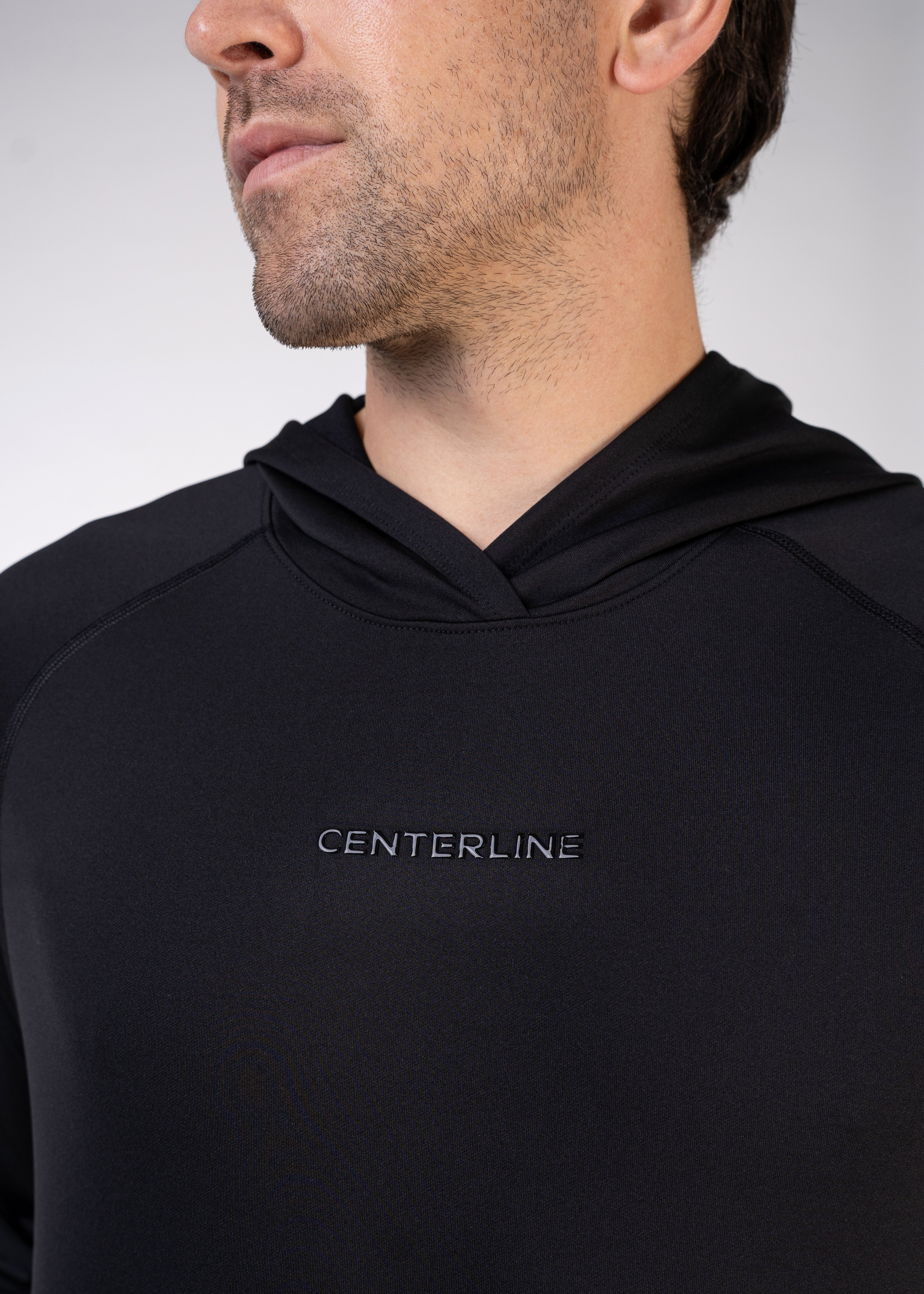Layering Hoodie Men's - FORWRD - Stay cool and comfortable with our performance-enhanced fabric, designed to regulate your temperature on and off the court. The curved hem allows for freedom of movement, while the extended back hem offers added coverage. Keep your sleeves secure with our discreet thumbholes—perfect for those chilly morning warm-ups or brisk climate play. This top is ideal for layering during warm-ups or tackling cooler conditions in style.