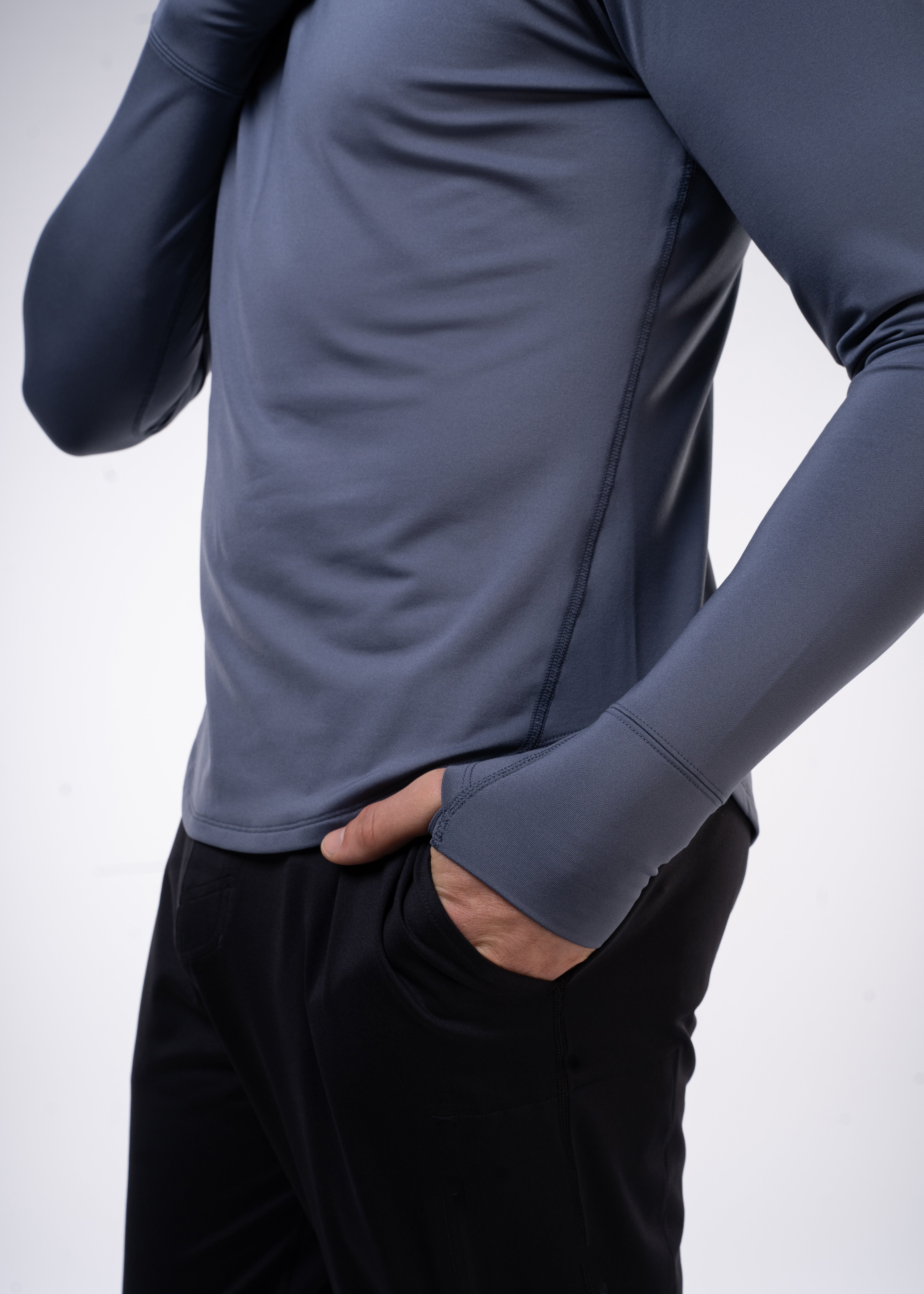 Layering Hoodie Men's - FORWRD - Stay cool and comfortable with our performance-enhanced fabric, designed to regulate your temperature on and off the court. The curved hem allows for freedom of movement, while the extended back hem offers added coverage. Keep your sleeves secure with our discreet thumbholes—perfect for those chilly morning warm-ups or brisk climate play. This top is ideal for layering during warm-ups or tackling cooler conditions in style.