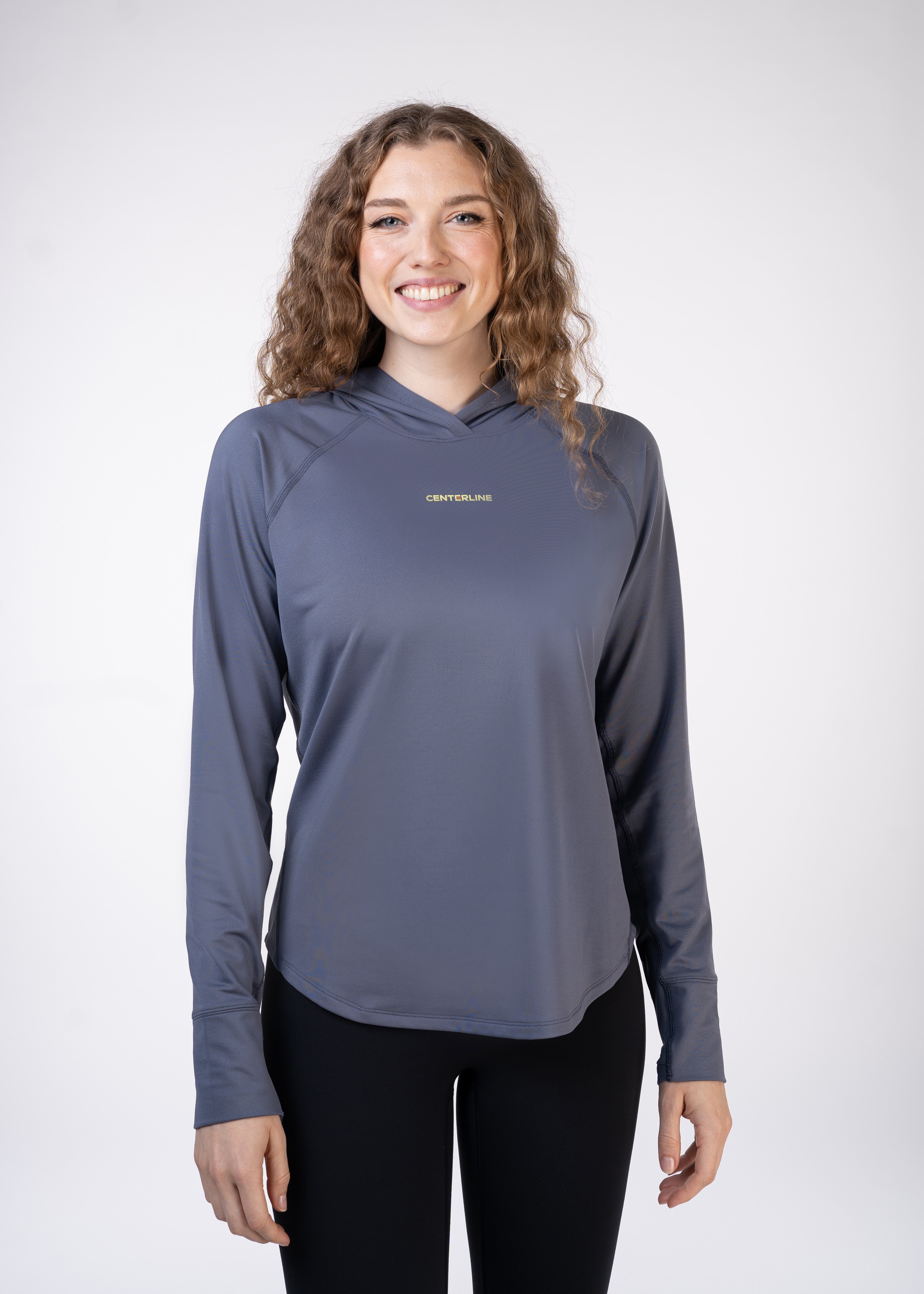 Layering Hoodie Women's - FORWRD - Stay cool and comfortable with our performance-enhanced fabric, designed to regulate your temperature on and off the court. The curved hem allows for freedom of movement, while the extended back hem offers added coverage. Keep your sleeves secure with our discreet thumbholes—perfect for those chilly morning warm-ups or brisk climate play. This top is ideal for layering during warm-ups or tackling cooler conditions in style.
