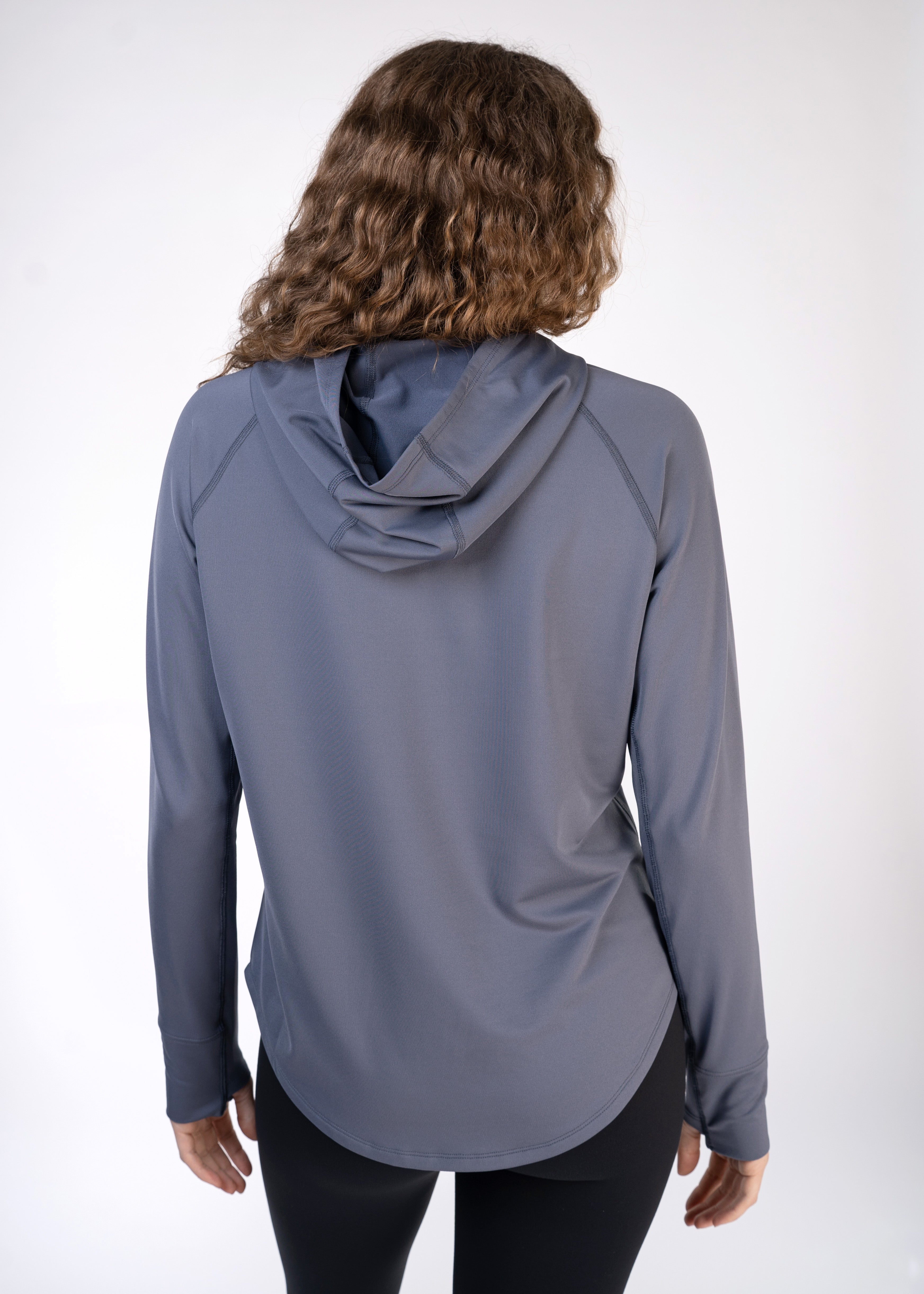 Layering Hoodie Women's - FORWRD - Stay cool and comfortable with our performance-enhanced fabric, designed to regulate your temperature on and off the court. The curved hem allows for freedom of movement, while the extended back hem offers added coverage. Keep your sleeves secure with our discreet thumbholes—perfect for those chilly morning warm-ups or brisk climate play. This top is ideal for layering during warm-ups or tackling cooler conditions in style.