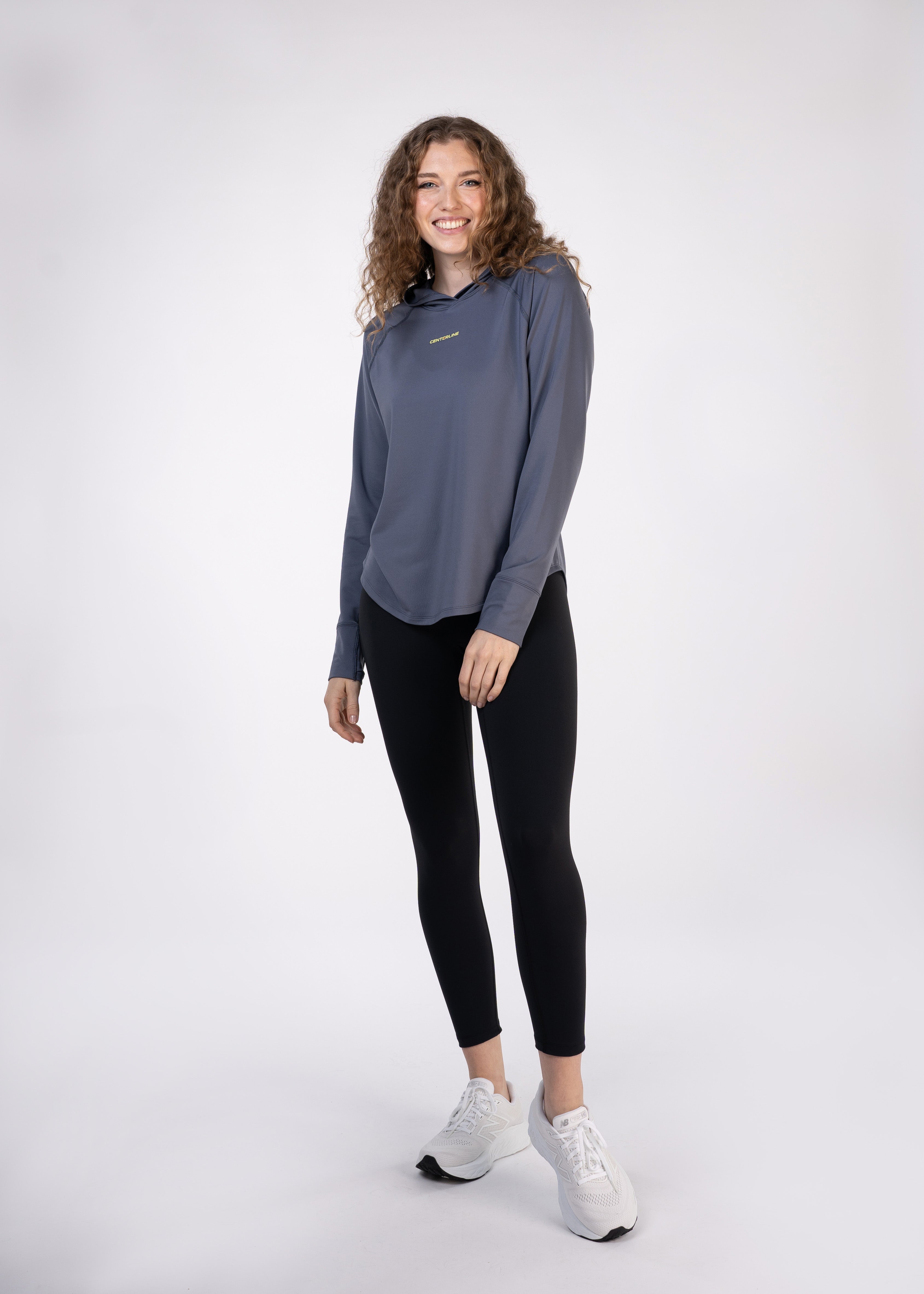 Layering Hoodie Women's - FORWRD - Stay cool and comfortable with our performance-enhanced fabric, designed to regulate your temperature on and off the court. The curved hem allows for freedom of movement, while the extended back hem offers added coverage. Keep your sleeves secure with our discreet thumbholes—perfect for those chilly morning warm-ups or brisk climate play. This top is ideal for layering during warm-ups or tackling cooler conditions in style.