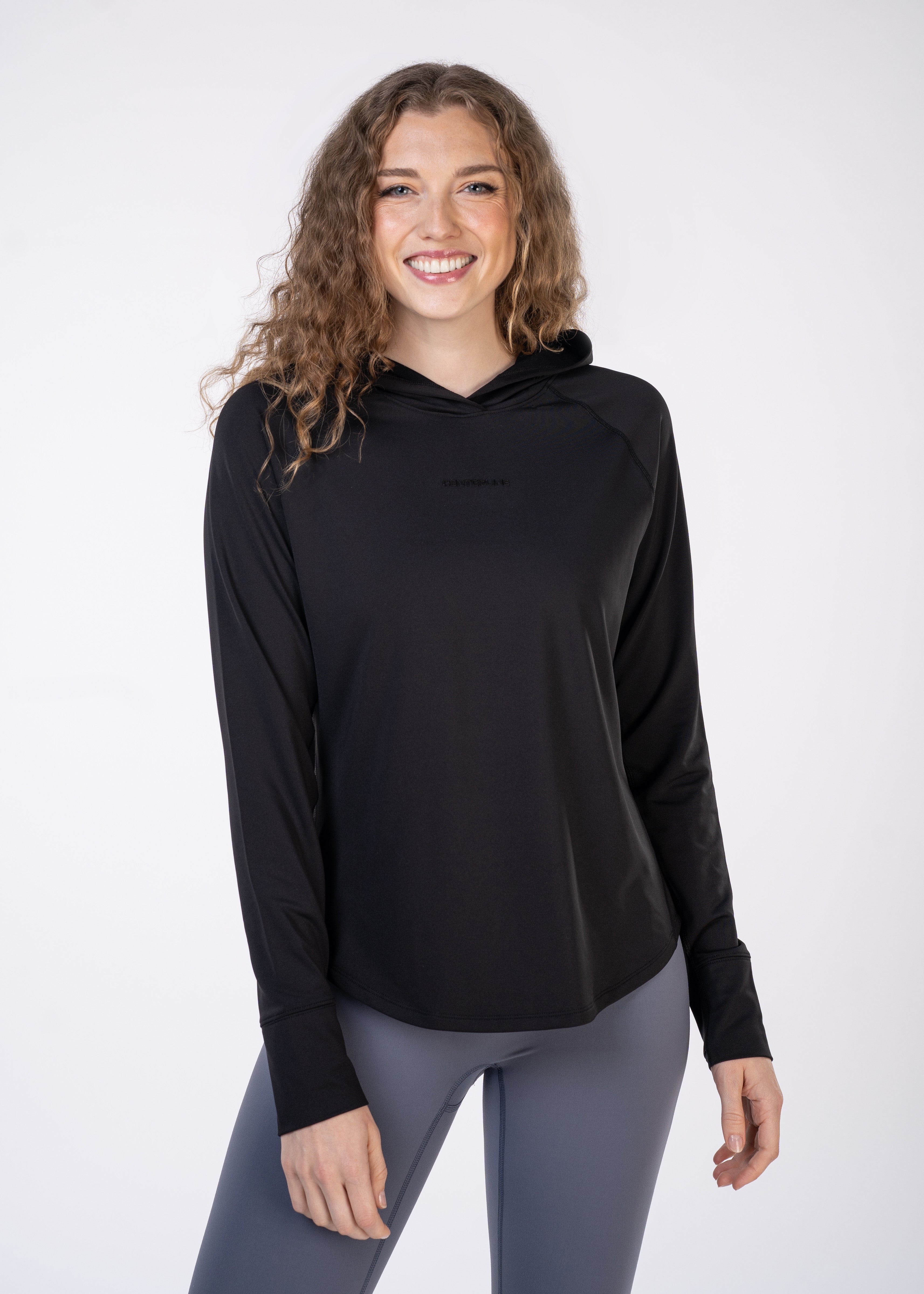Layering Hoodie Women's - FORWRD - Stay cool and comfortable with our performance-enhanced fabric, designed to regulate your temperature on and off the court. The curved hem allows for freedom of movement, while the extended back hem offers added coverage. Keep your sleeves secure with our discreet thumbholes—perfect for those chilly morning warm-ups or brisk climate play. This top is ideal for layering during warm-ups or tackling cooler conditions in style.