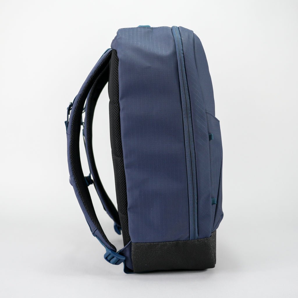 Navy blue backpack on a white background