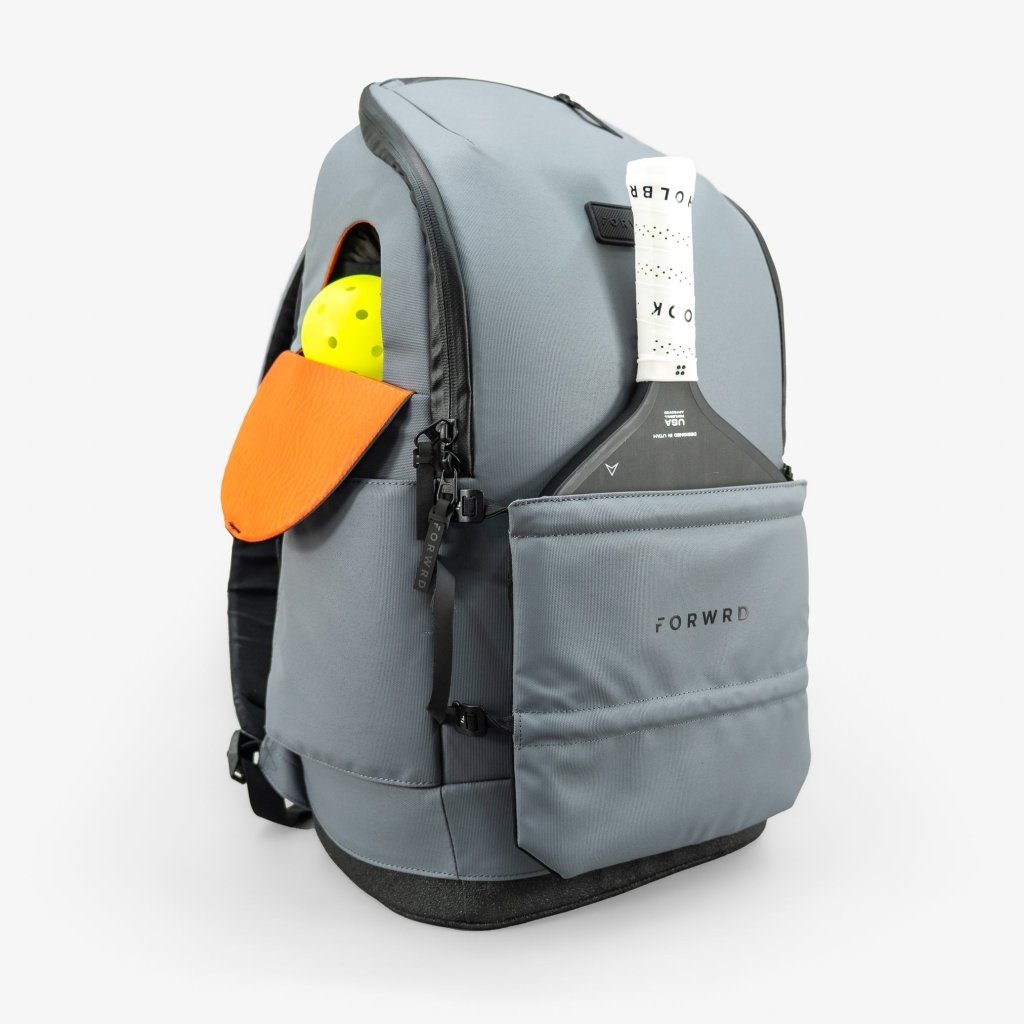 Gray backpack with orange flap and yellow item on a white background