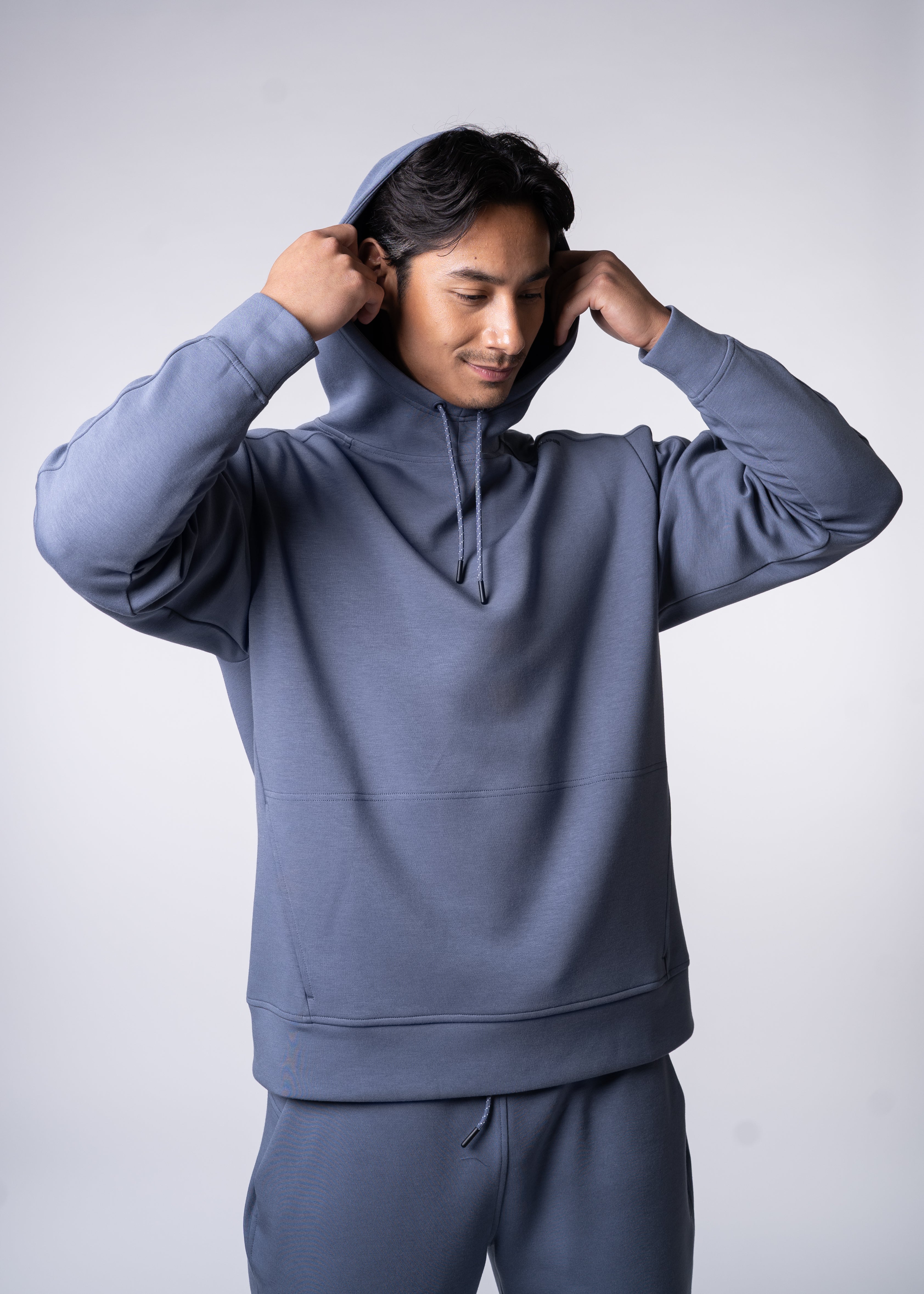 Apres Unisex Hooded Sweatshirt - FORWRD  -  The ultimate post-game hooded pullover, designed with a relaxed varsity-inspired fit for comfort and style. Soft and comfortable, water repellent fabric, with a fully functional hood with adjustable draw cord helps keep you protected from the elements. Front hand pockets offer a secure phone storage option, adding practicality to this street-style piece that easily transitions from court to casual activities. This unisex hoodie has an athletic fit