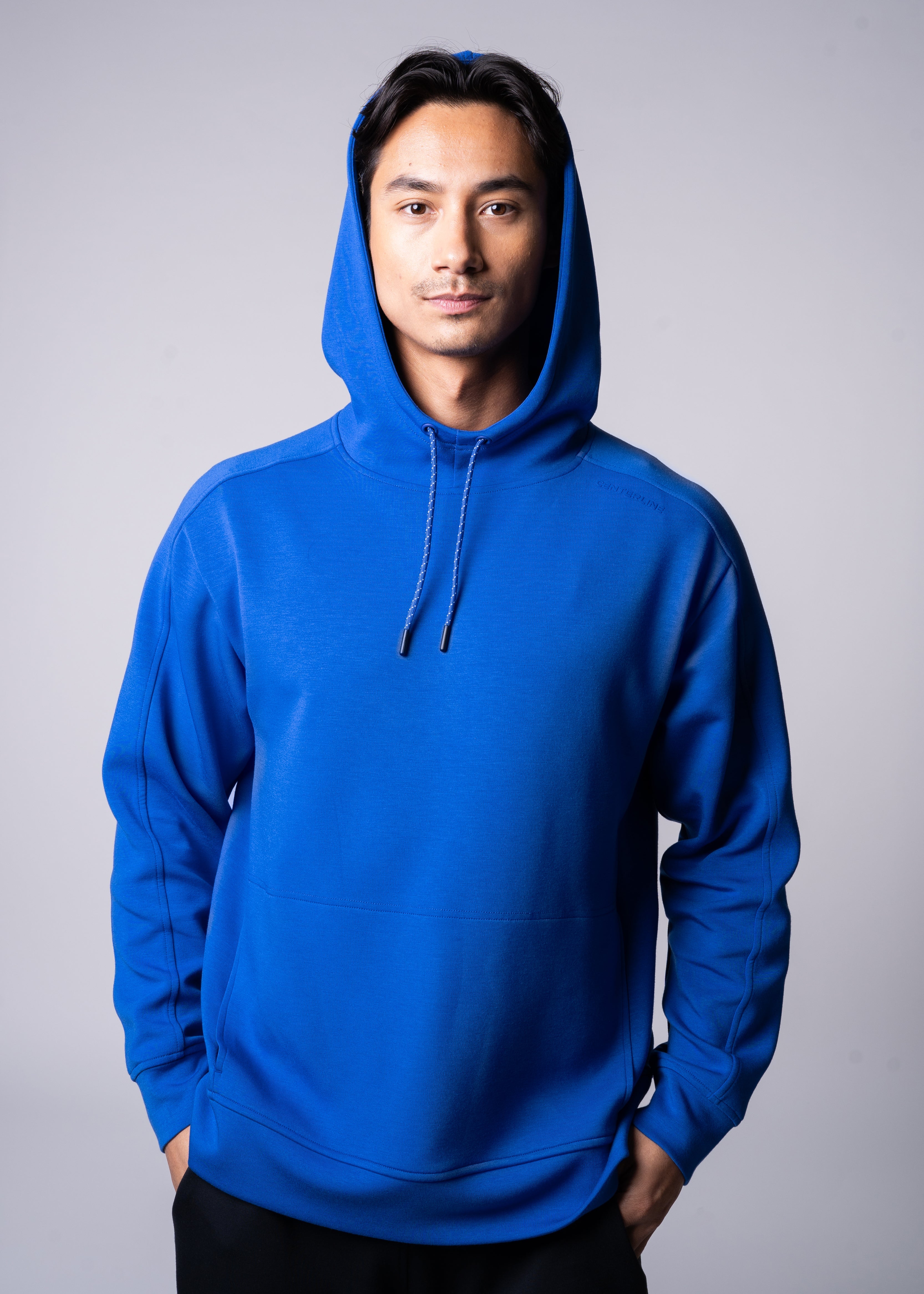 Apres Unisex Hooded Sweatshirt - FORWRD  -  The ultimate post-game hooded pullover, designed with a relaxed varsity-inspired fit for comfort and style. Soft and comfortable, water repellent fabric, with a fully functional hood with adjustable draw cord helps keep you protected from the elements. Front hand pockets offer a secure phone storage option, adding practicality to this street-style piece that easily transitions from court to casual activities. This unisex hoodie has an athletic fit