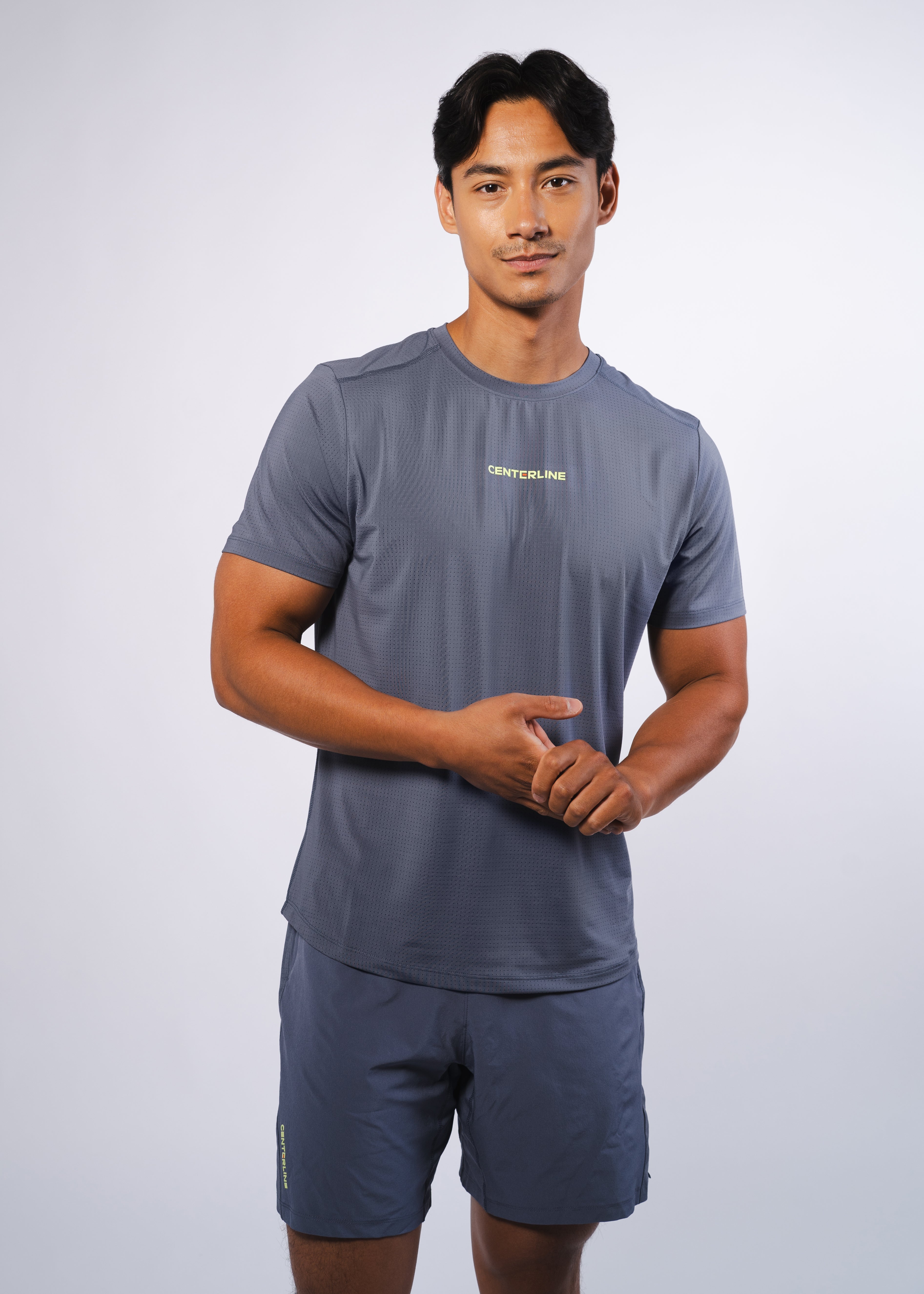 AirLite Men's Tee - FORWRD  -  Elevate your game with the AirLite Men's Tee, engineered from ultra-breathable mesh fabric for unmatched ventilation during pickleball play. Curved hem ensures confidence in every move, allowing you to showcase your agility without compromising on comfort. Experience the perfect blend of style and performance with this essential addition to your wardrobe.