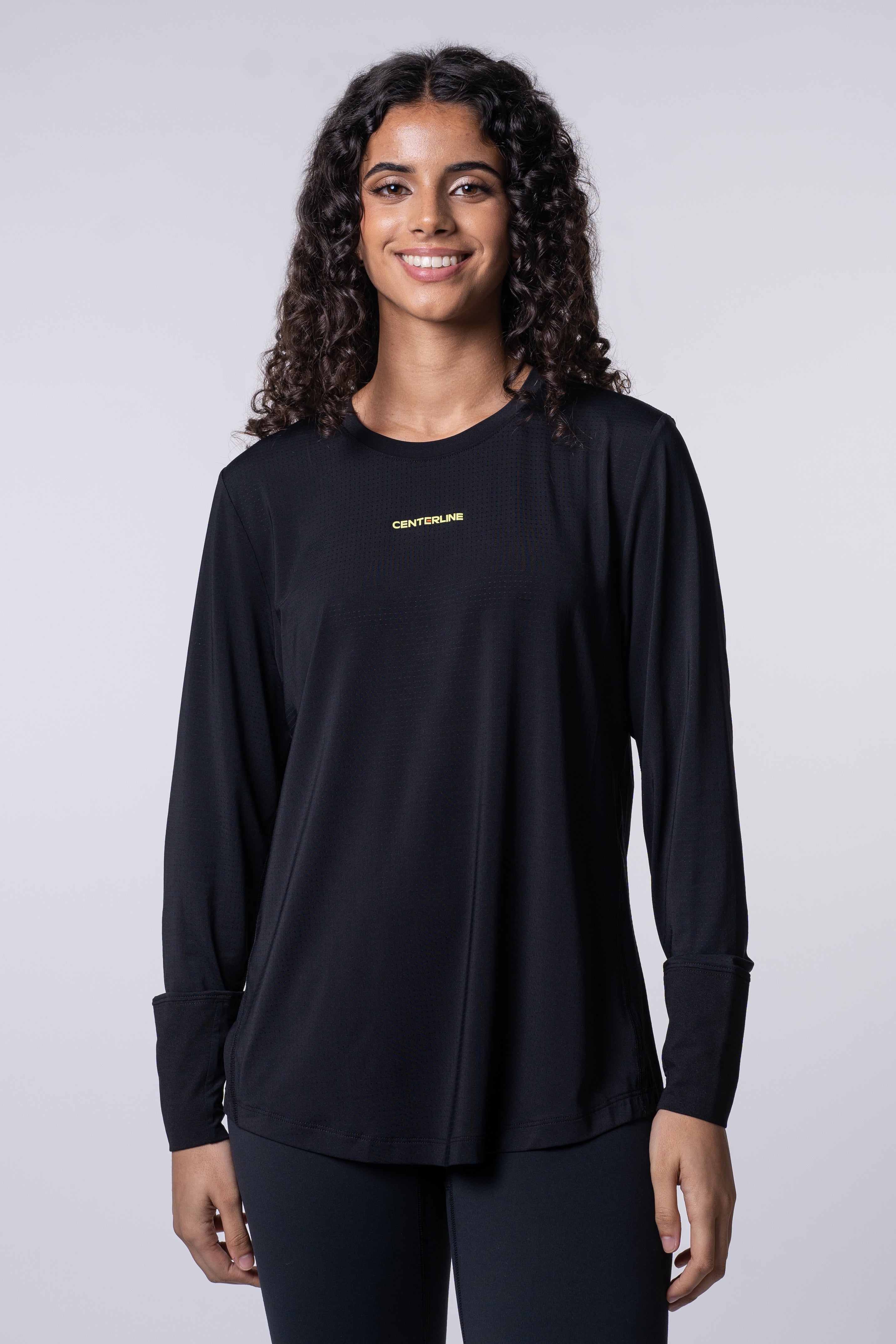 AirLite Women's Long Sleeve - FORWRD  -  Introducing the AirLite Women's Long Sleeve top, engineered with innovative GripTek™ textured knit on the sleeve cuffs. This top doubles as a convenient towel for quick perspiration management during matches. Experience next-level performance and functionality with this essential piece, ensuring you stay focused and comfortable on the court. Elevate your game with every serve, volley, and smash in this game-changing top.