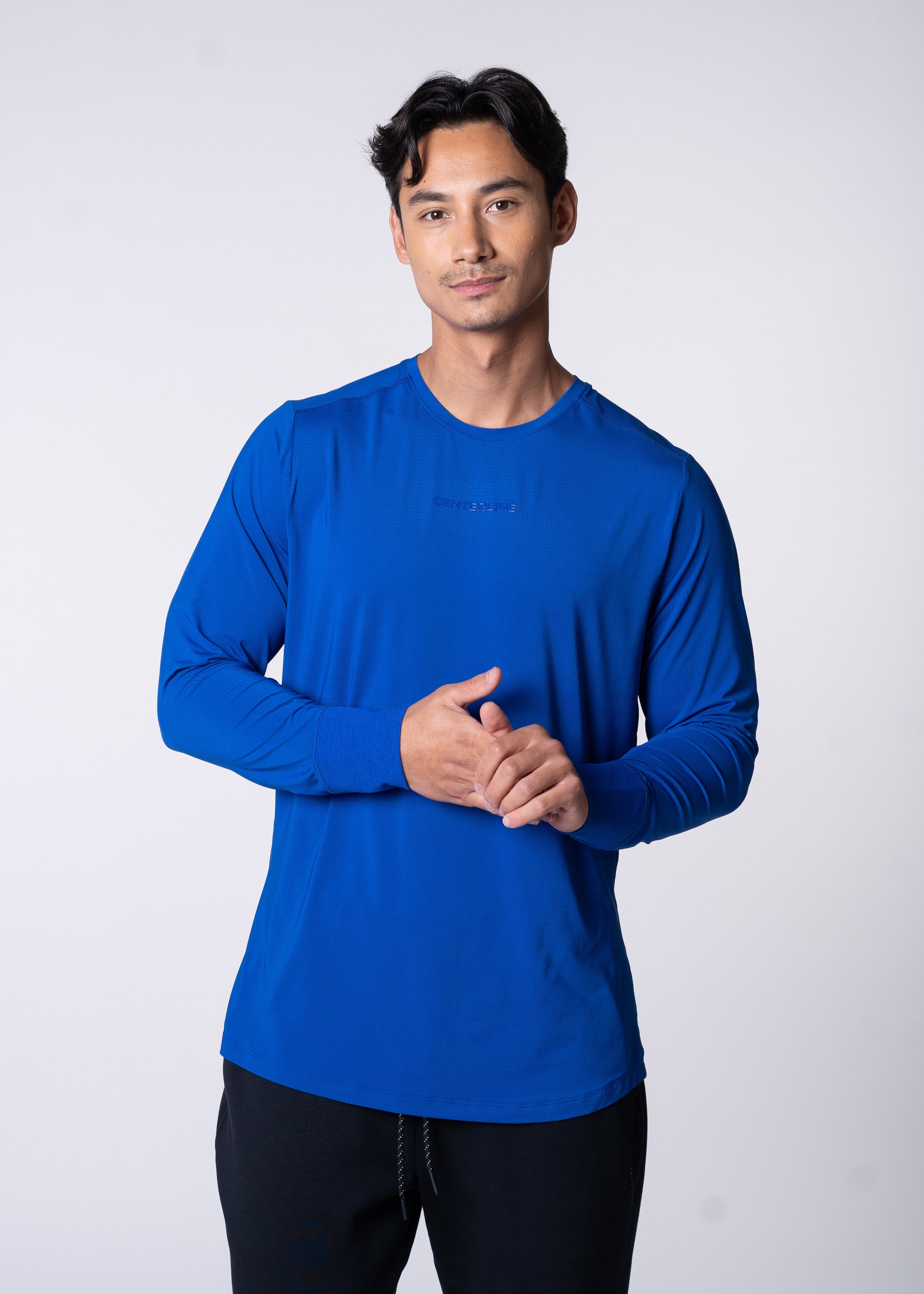 AirLite Men's Long Sleeve - FORWRD  -  Introducing the AirLite Men's Long Sleeve top, engineered with innovative GripTek™ textured knit on the sleeve cuffs. This top doubles as a convenient towel for quick perspiration management during matches. Experience next-level performance and functionality with this essential piece, ensuring you stay focused and comfortable on the court. Elevate your game with every serve, volley, and smash in this game-changing top.