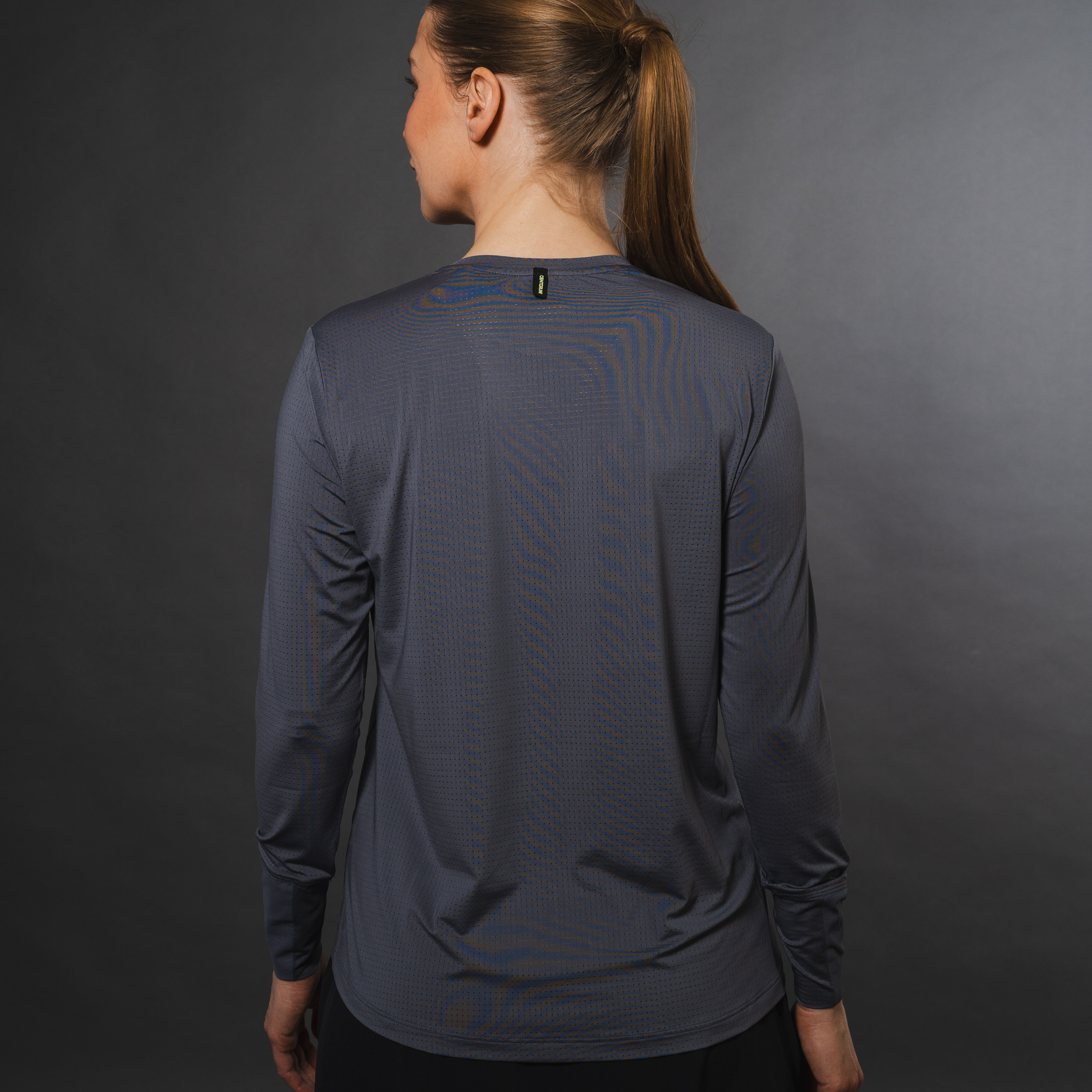 AirLite Women's Long Sleeve - FORWRD  -  Introducing the AirLite Women's Long Sleeve top, engineered with innovative GripTek™ textured knit on the sleeve cuffs. This top doubles as a convenient towel for quick perspiration management during matches. Experience next-level performance and functionality with this essential piece, ensuring you stay focused and comfortable on the court. Elevate your game with every serve, volley, and smash in this game-changing top.