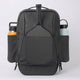 Black backpack with water bottles attached on a light gray background