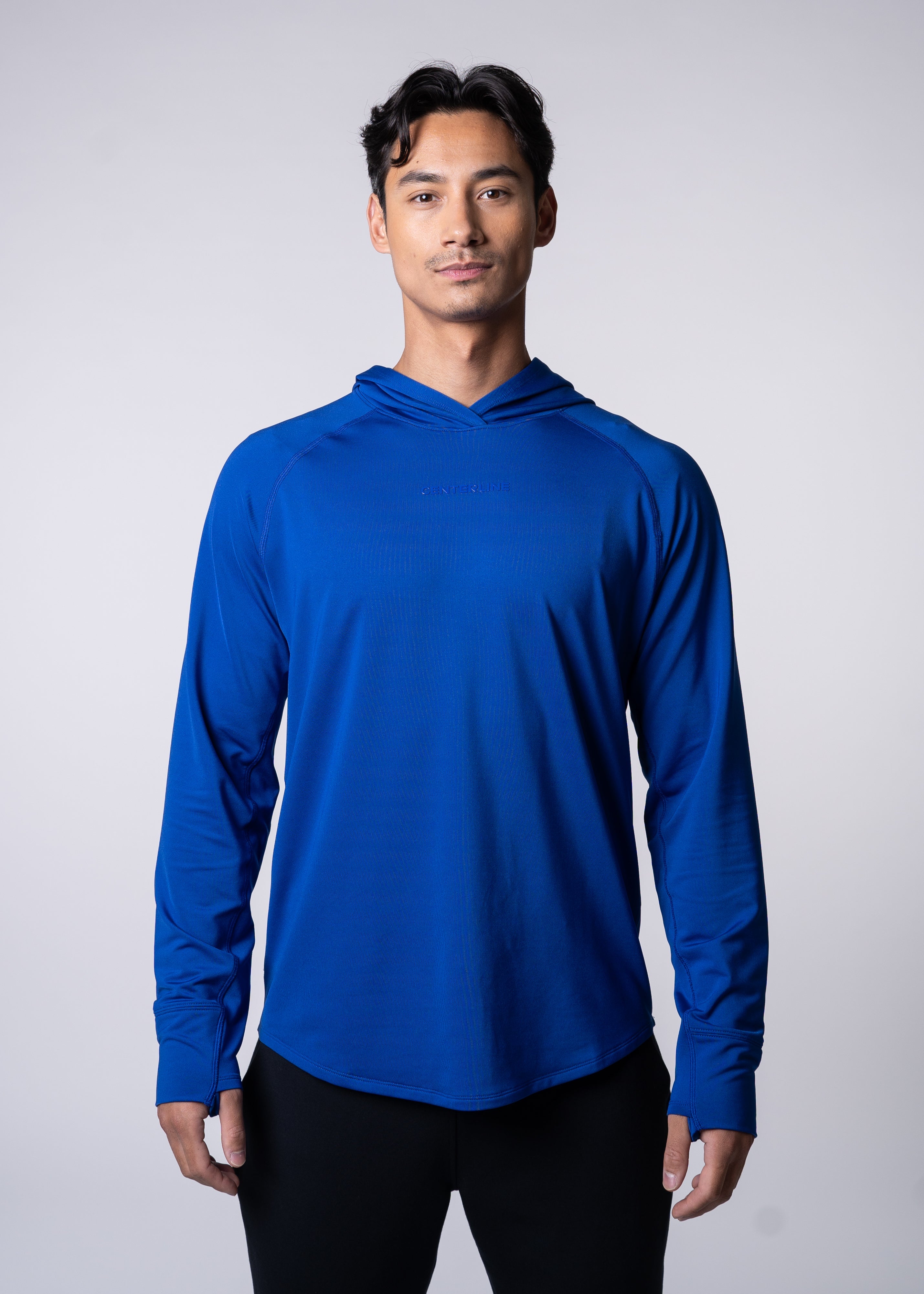 Layering Hoodie Men's - FORWRD  -  Stay cool and comfortable with our performance-enhanced fabric, designed to regulate your temperature on and off the court. The curved hem allows for freedom of movement, while the extended back hem offers added coverage. Keep your sleeves secure with our discreet thumbholes—perfect for those chilly morning warm-ups or brisk climate play. This top is ideal for layering during warm-ups or tackling cooler conditions in style.