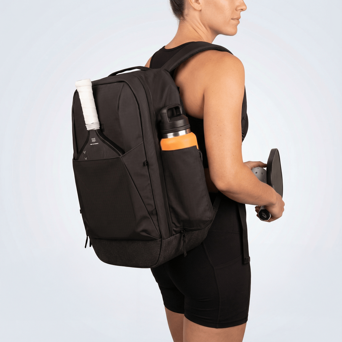Court Ranger V2 in a lifestyle context — player with bag that looks equally at home in any setting
