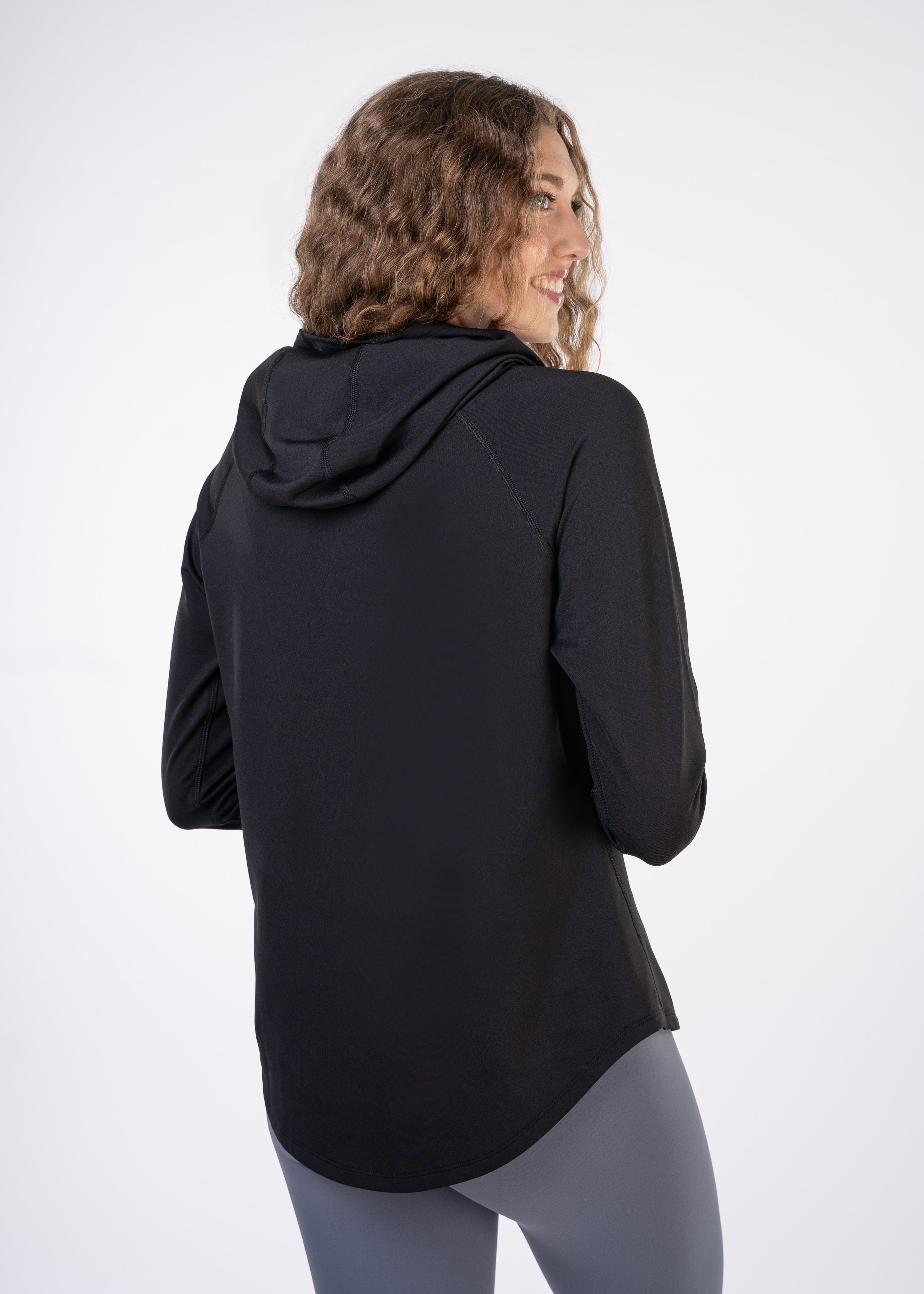 Layering Hoodie Women's - FORWRD  -  Stay cool and comfortable with our performance-enhanced fabric, designed to regulate your temperature on and off the court. The curved hem allows for freedom of movement, while the extended back hem offers added coverage. Keep your sleeves secure with our discreet thumbholes—perfect for those chilly morning warm-ups or brisk climate play. This top is ideal for layering during warm-ups or tackling cooler conditions in style.