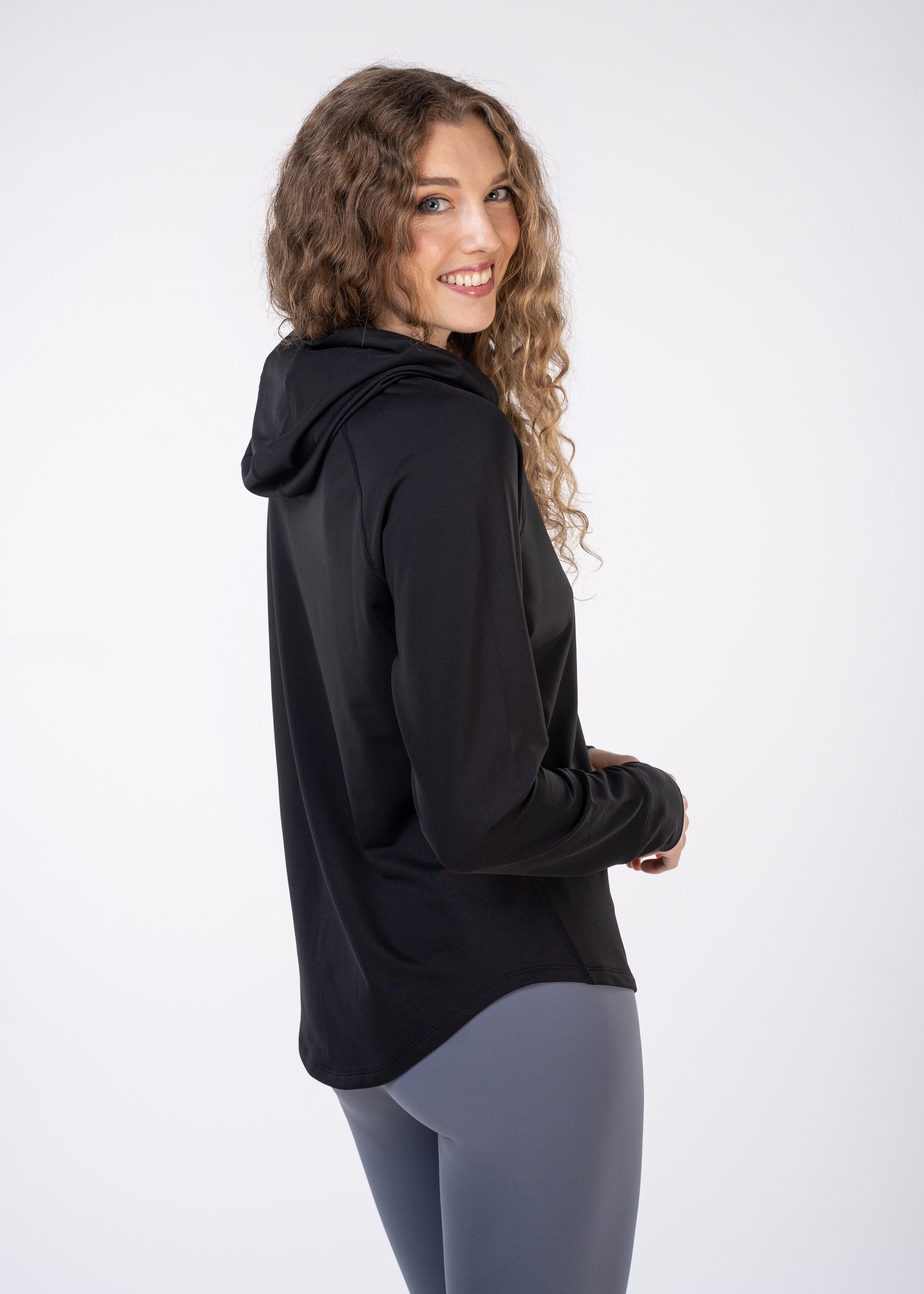 Layering Hoodie Women's - FORWRD  -  Stay cool and comfortable with our performance-enhanced fabric, designed to regulate your temperature on and off the court. The curved hem allows for freedom of movement, while the extended back hem offers added coverage. Keep your sleeves secure with our discreet thumbholes—perfect for those chilly morning warm-ups or brisk climate play. This top is ideal for layering during warm-ups or tackling cooler conditions in style.