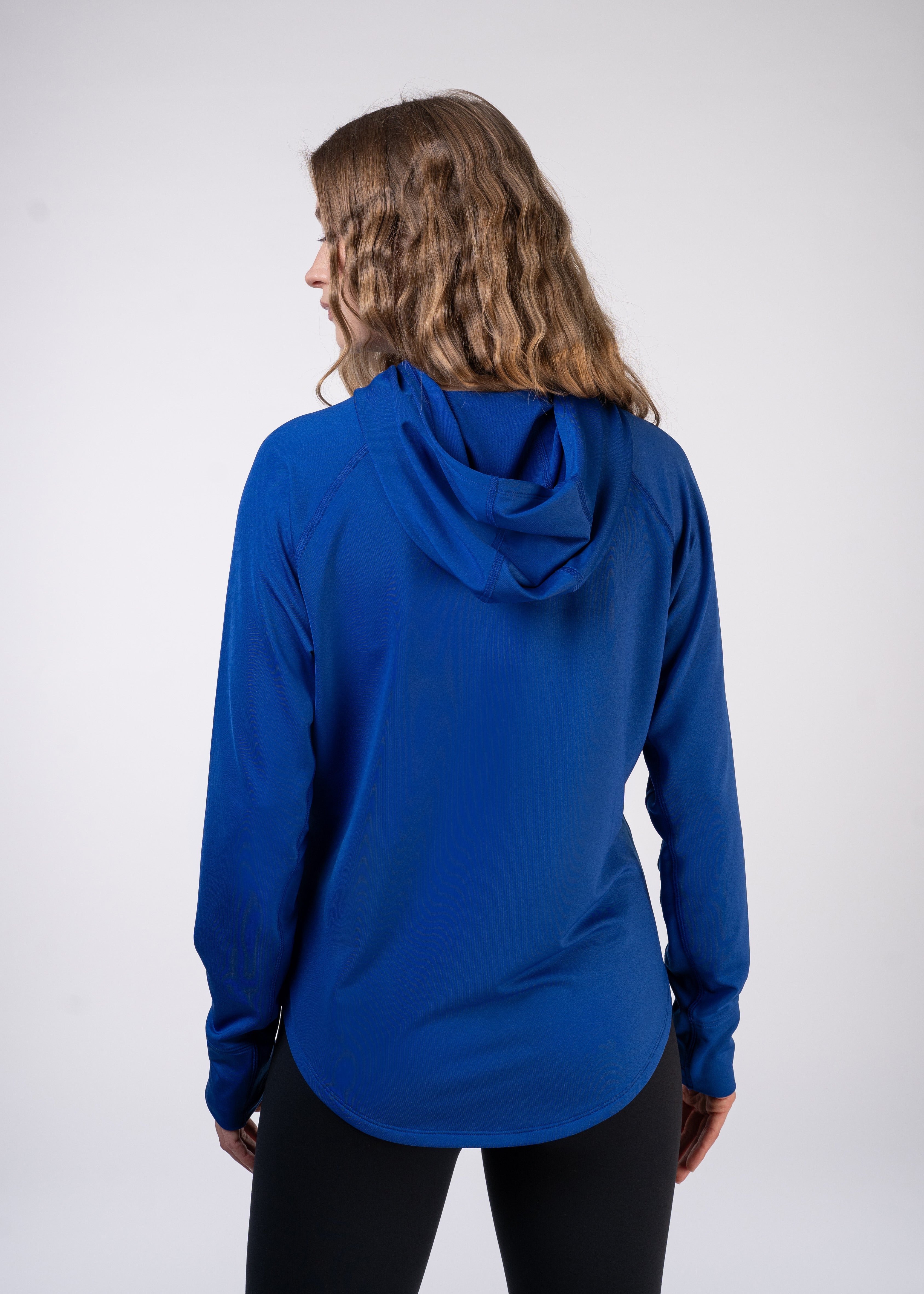 Layering Hoodie Women's - FORWRD  -  Stay cool and comfortable with our performance-enhanced fabric, designed to regulate your temperature on and off the court. The curved hem allows for freedom of movement, while the extended back hem offers added coverage. Keep your sleeves secure with our discreet thumbholes—perfect for those chilly morning warm-ups or brisk climate play. This top is ideal for layering during warm-ups or tackling cooler conditions in style.