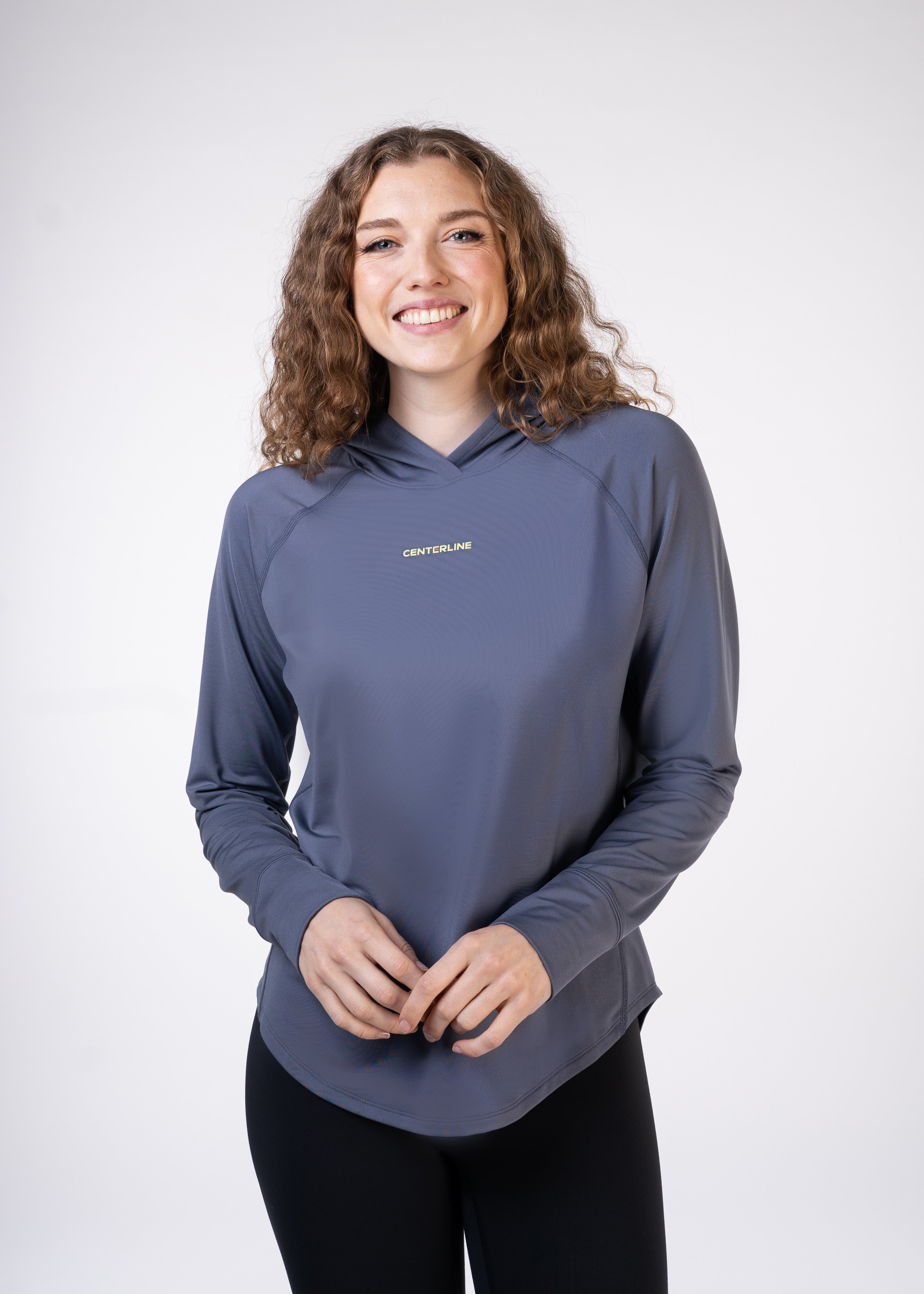 Layering Hoodie Women's - FORWRD  -  Stay cool and comfortable with our performance-enhanced fabric, designed to regulate your temperature on and off the court. The curved hem allows for freedom of movement, while the extended back hem offers added coverage. Keep your sleeves secure with our discreet thumbholes—perfect for those chilly morning warm-ups or brisk climate play. This top is ideal for layering during warm-ups or tackling cooler conditions in style.